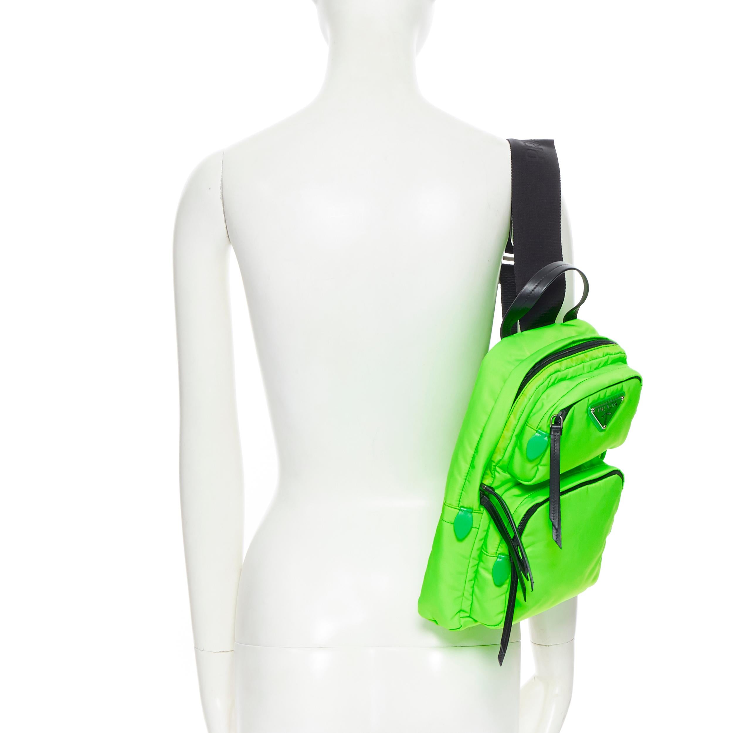 new PRADA 2018 Fluorescent neon green dual pocket one shoulder small backpack
Brand: Prada
Designer: Miuccia Prada
Collection: Fall Winter 2019
As seen on: Gigi Hadid
Model Name / Style: One shoulder backpack
Material: Nylon
Color: Green
Pattern: