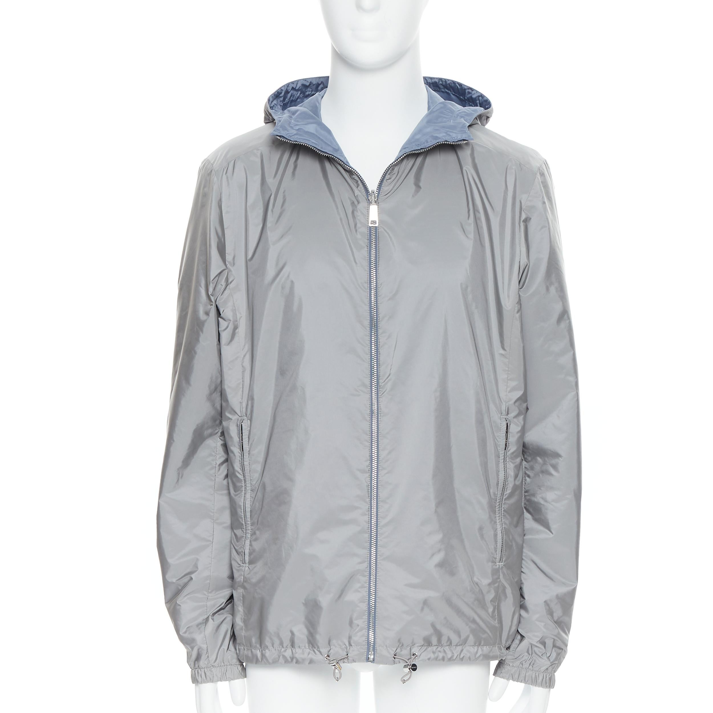 new PRADA 2018 grey blue nylon reversible hooded windbreaker jacket IT56 3XL 
Reference: TGAS/B00374 
Brand: Prada 
Designer: Miuccia Prada 
Material: Nylon 
Color: Grey 
Pattern: Solid 
Closure: Zip 
Extra Detail: Reversible on both sides. Grey and