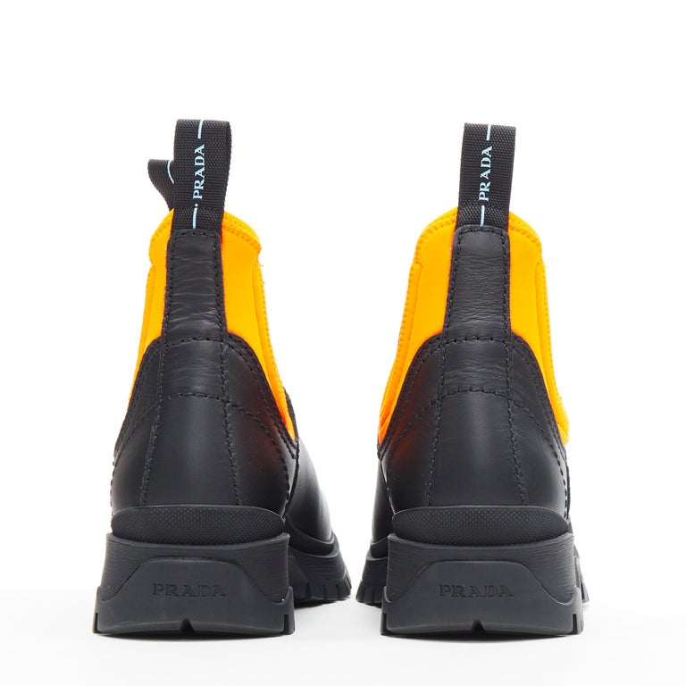new PRADA 2018 Runway neon orange neoprene black leather ankle combat boot  EU40 at 1stDibs | prada neoprene boots, prada boots 2018, black and orange  prada boots