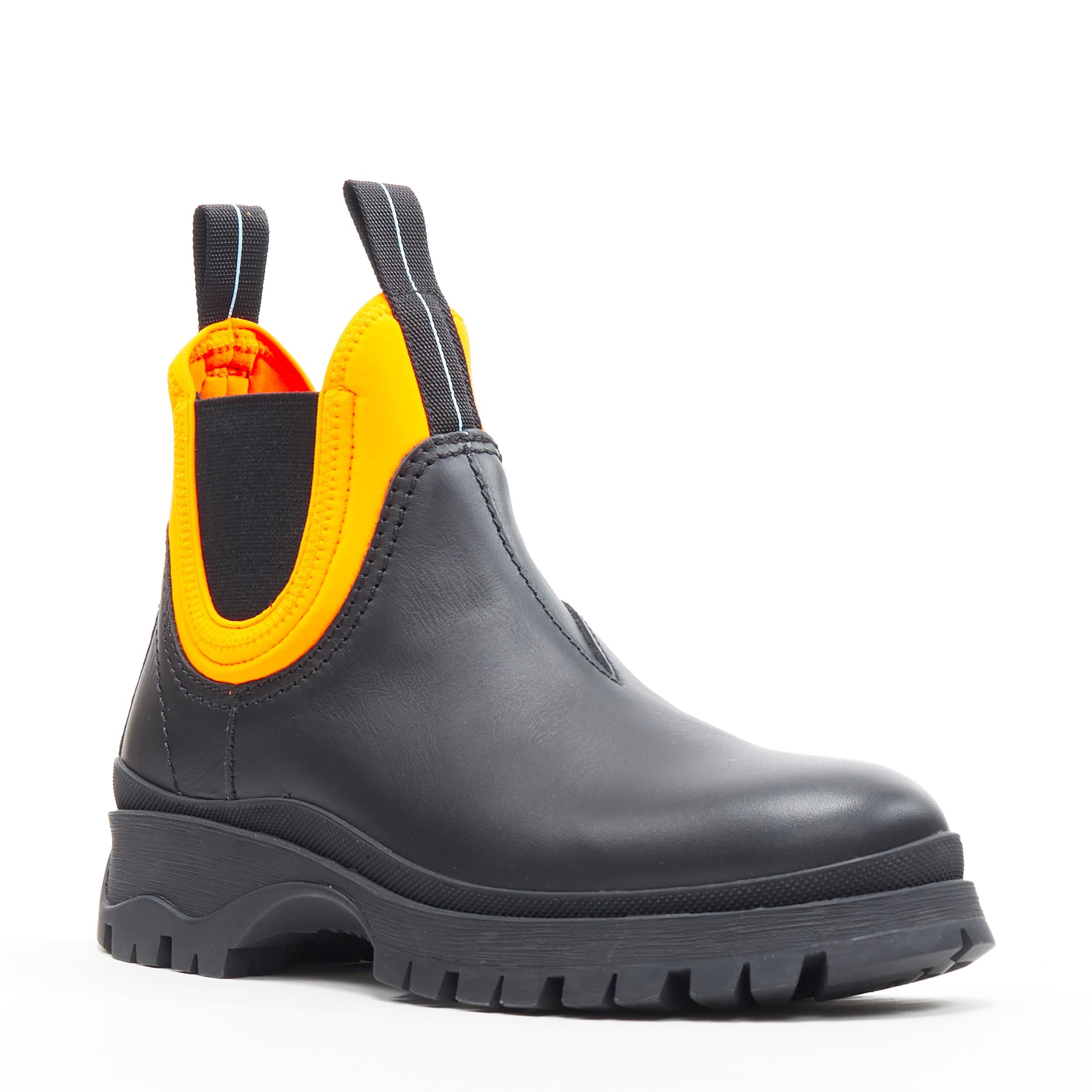 new PRADA 2018 Runway neon orange neoprene black leather chelsea boot EU39.5
Brand: Prada
Designer: Miuccia Prada
Collection: AW2018
Model Name / Style: Neoprene boots
Material: Leather, neoprene
Color: Black, neon orange
Pattern: Solid
Extra