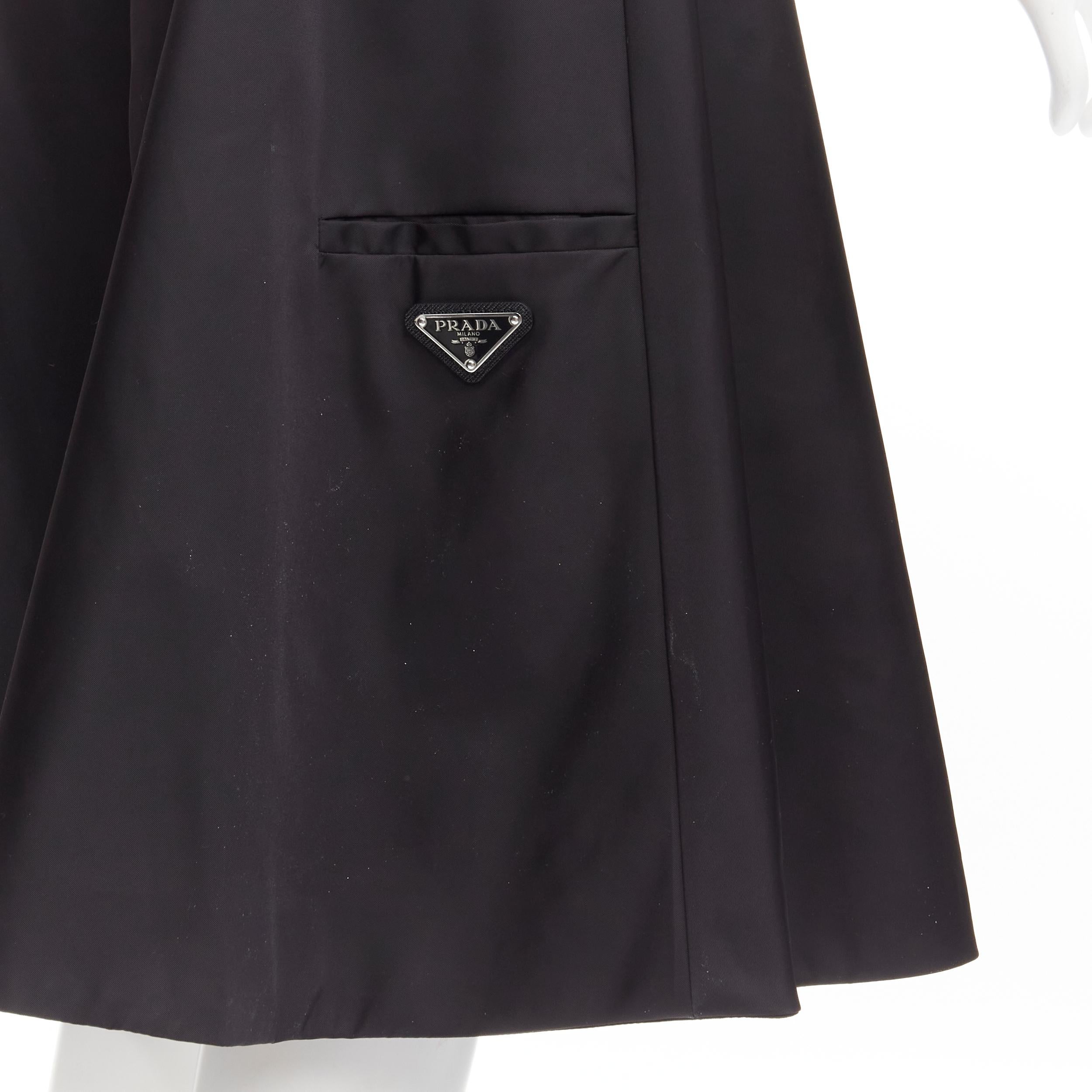 new PRADA 2019 black triangle logo seal plaque A-line flared skirt IT38 XS 
Reference: MELK/A00062 
Brand: Prada 
Collection: 2019 
Material: Nylon 
Color: Black 
Pattern: Solid 
Closure: Zip 
Made in: Romania 

CONDITION: 
Condition: New without
