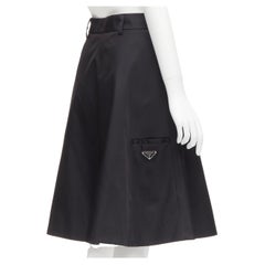 new PRADA 2019 black triangle logo seal plaque A-line flared skirt IT38 XS