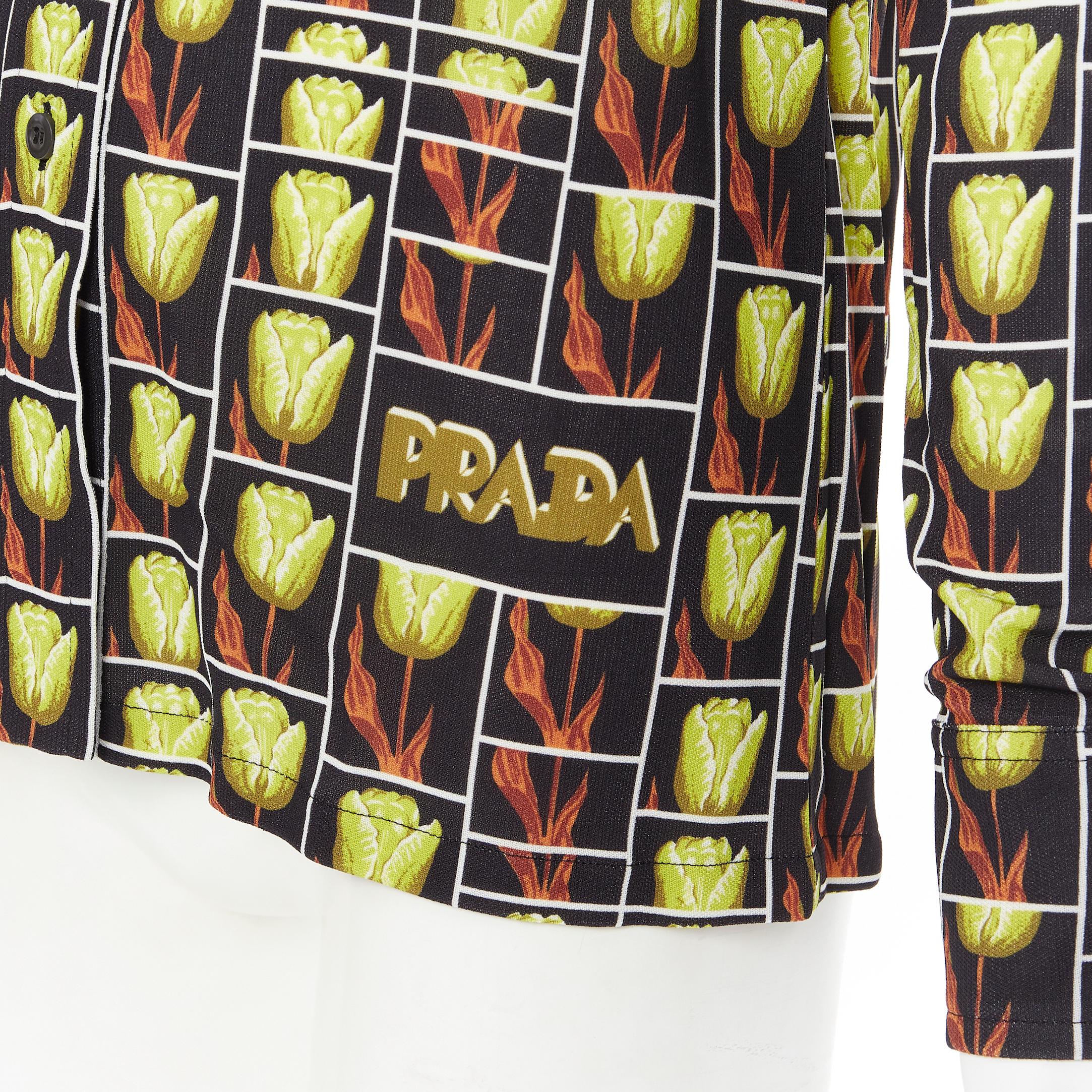 new PRADA 2019 black yellow tulip floral logo print long sleeve shirt IT38 XS 
Reference: TGAS/B00414 
Brand: Prada 
Designer: Miuccia Prada 
Collection: Resort 2019 
Material: Viscose 
Color: Black 
Pattern: Floral 
Closure: Button 
Extra Detail: