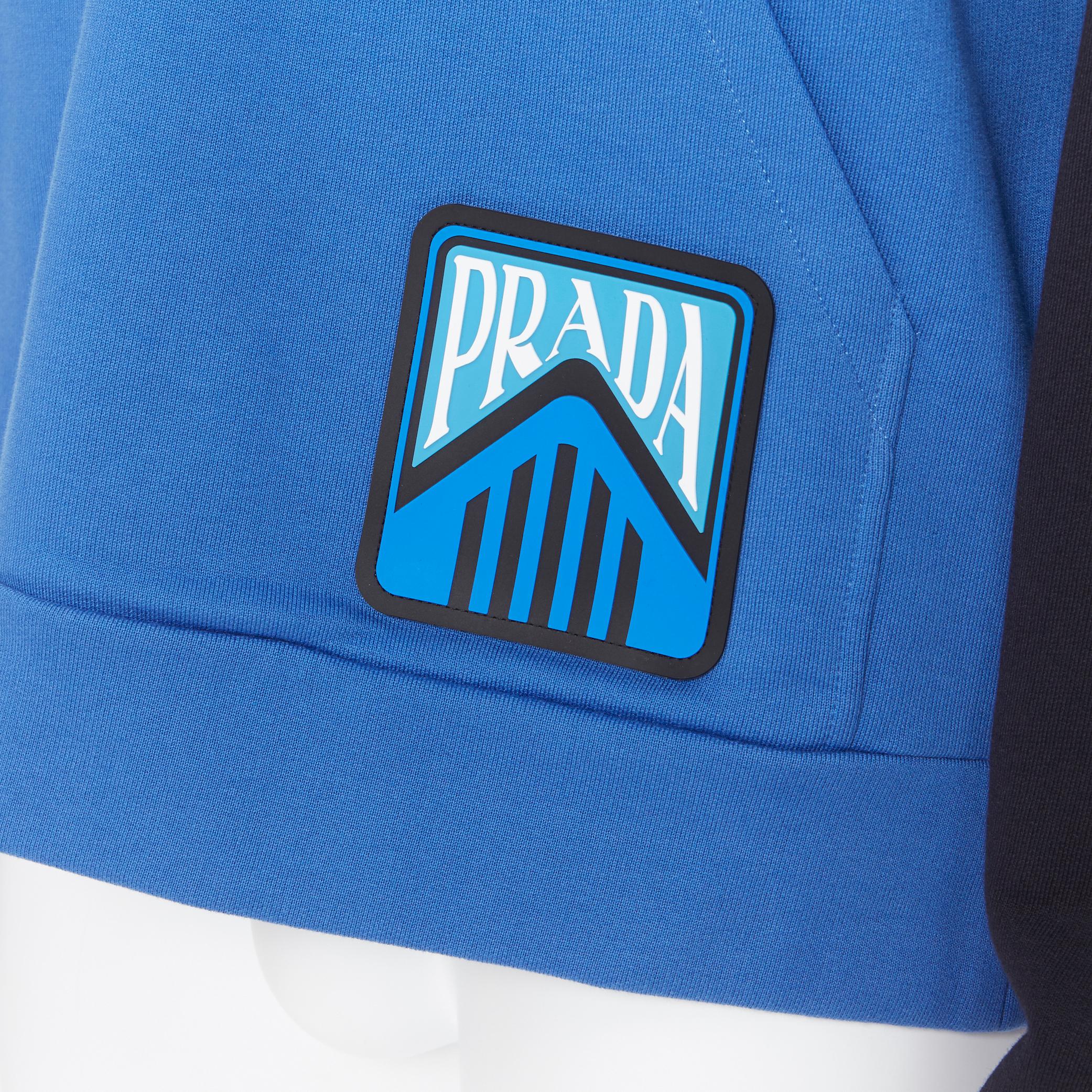 new PRADA 2019 navy blue colorblocked half zip sports logo pullover hoodie XL 
Reference: TGAS/A05889 
Brand: Prada 
Designer: Miuccia Prada 
Collection: Spring Summer 2019 
Material: Cotton 
Color: Blue 
Pattern: Solid 
Closure: Zip 
Extra Detail: