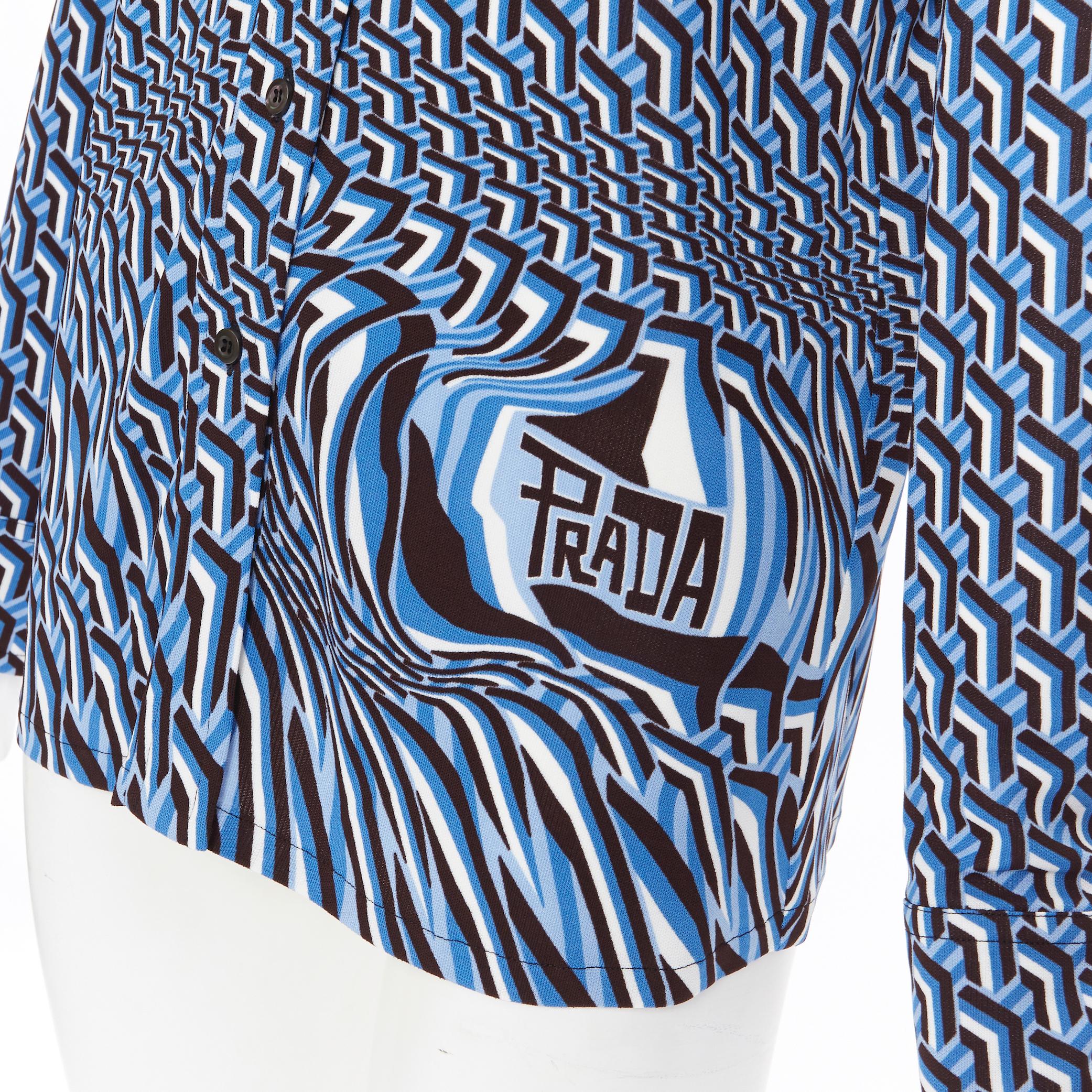 new PRADA 2019 Runway Illusion Geometric Twist logo knit blouse shirt IT40 S
Brand: Prada
Designer: Miuccia Prada
Collection: Resort 2019
Model Name / Style: Shirt
Material: Viscose
Color: Blue
Pattern: Abstract
Closure: Button
Extra Detail: