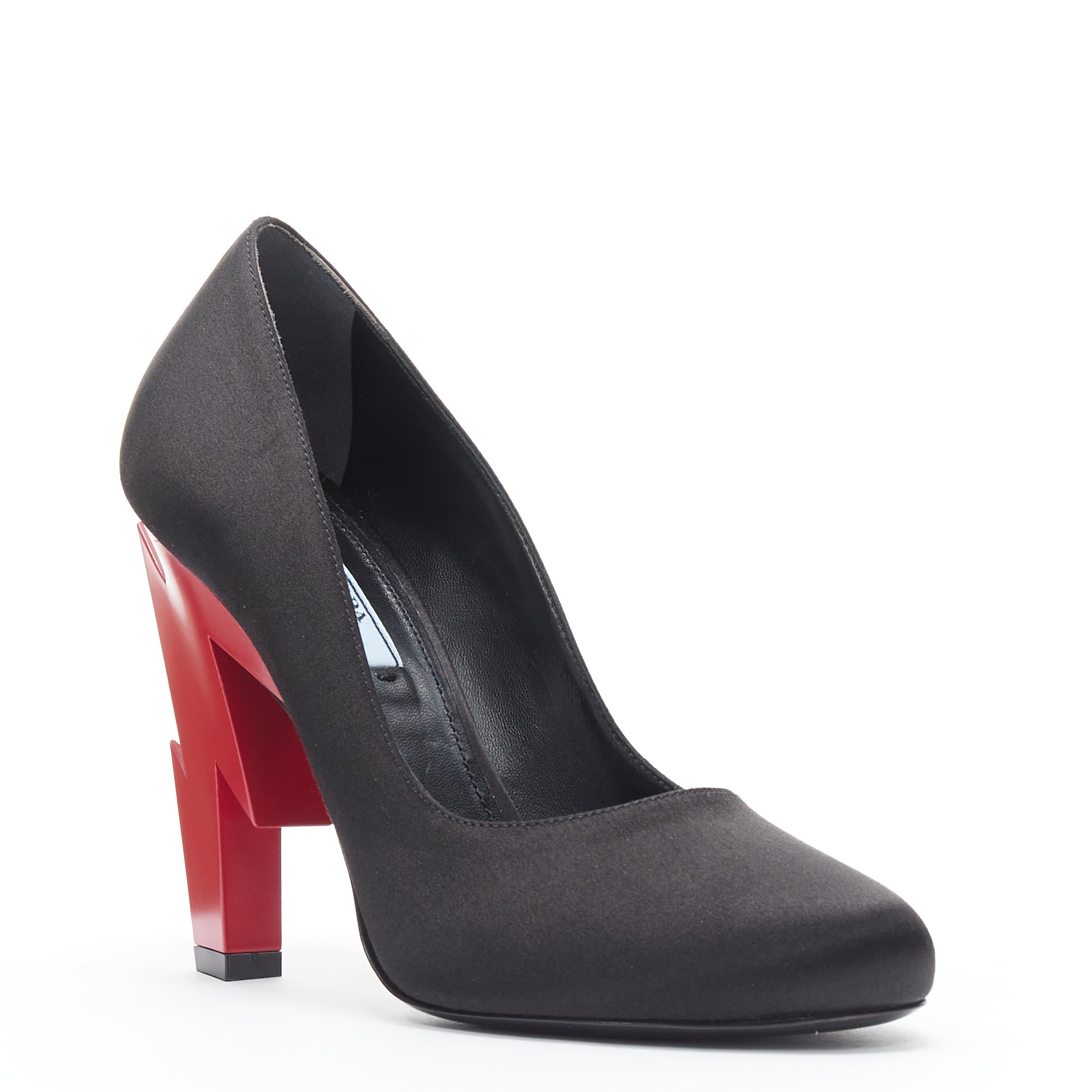 new PRADA 2019 Runway red lightning bolt heel black satin pump EU37.5 
Reference: TGAS/B01290 
Brand: Prada 
Designer: Miuccia Prada 
Model: Red Lightning heel 
Collection: Fall Winter 2019 Material: Silk Color: Black Pattern: Solid 
Extra Detail: