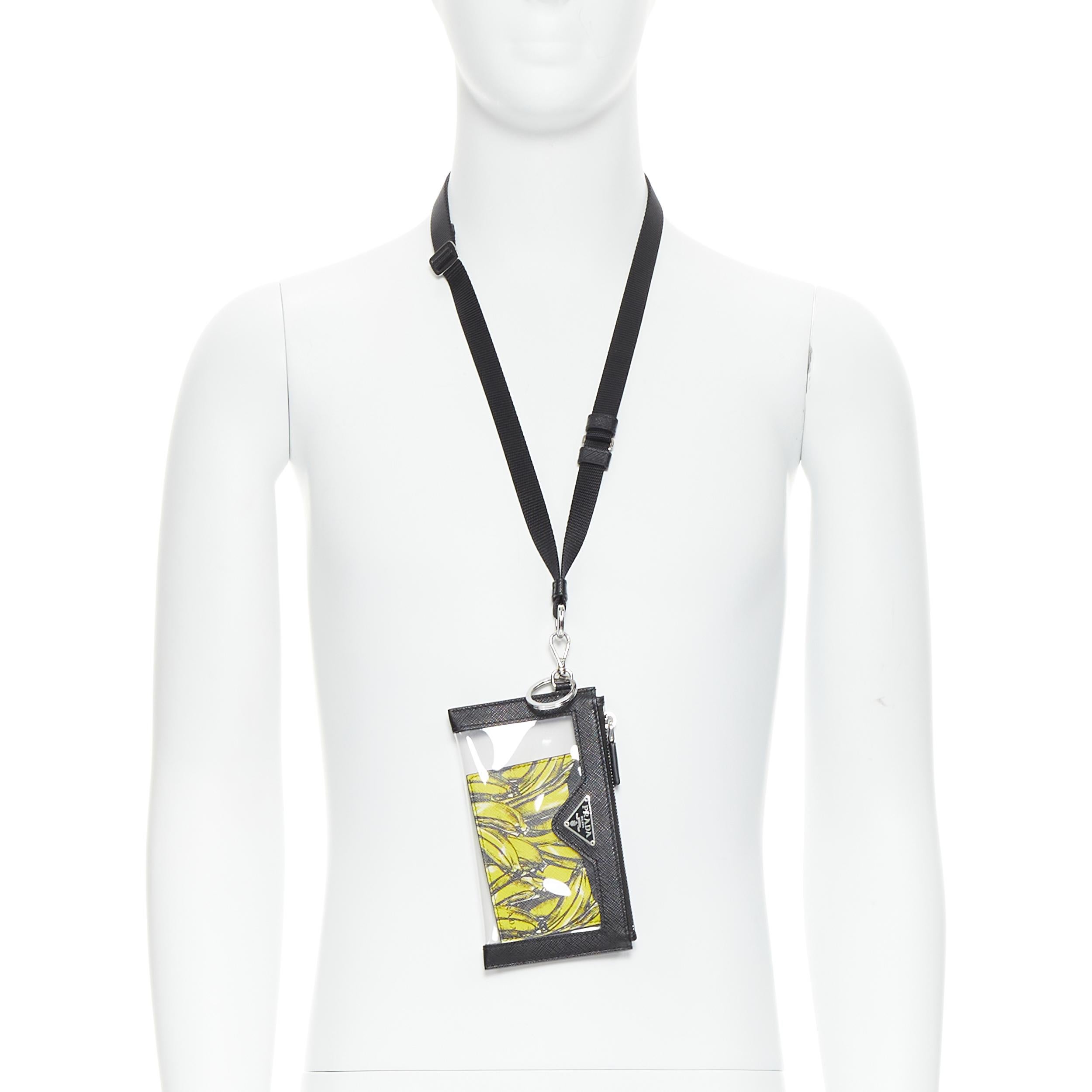 new PRADA Banana print cardholder enamel logo PVC lanyard case 
Reference: TGAS/B00473 
Brand: Prada 
Designer: Miuccia Prada 
Material: Leather 
Color: Black 
Pattern: Other 
Closure: Zip 
Extra Detail: Signature yellow Banana print saffiano card