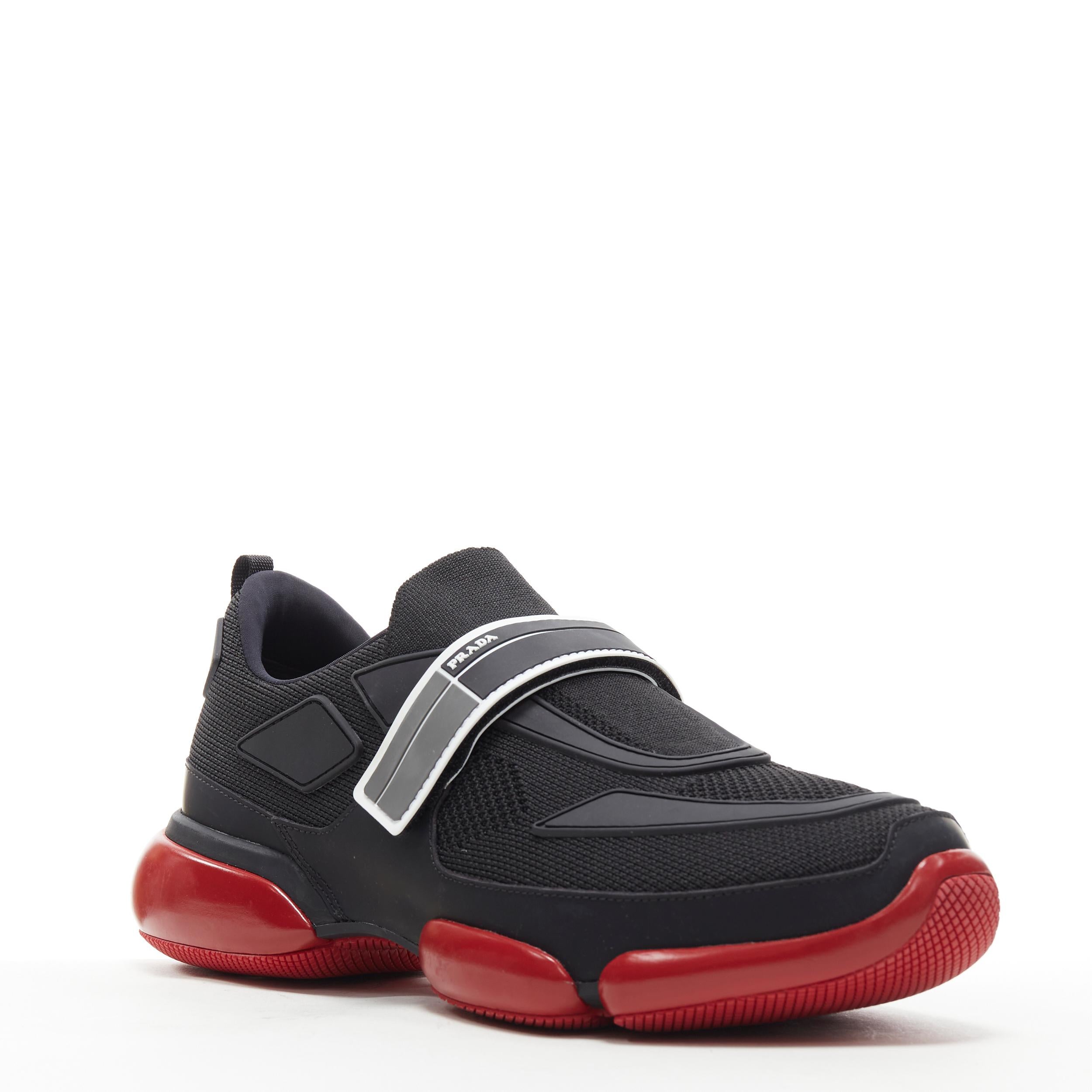 new PRADA Cloudbust black red logo rubber strapped low top sneakers UK7 US8 EU41 Reference: TGAS/B00581 
Brand: Prada 
Designer: Miuccia Prada 
Model: Cloudbust 
As seen on: ASAP Rocky 
Material: Fabric 
Color: Black 
Pattern: Solid 
Closure: Magic