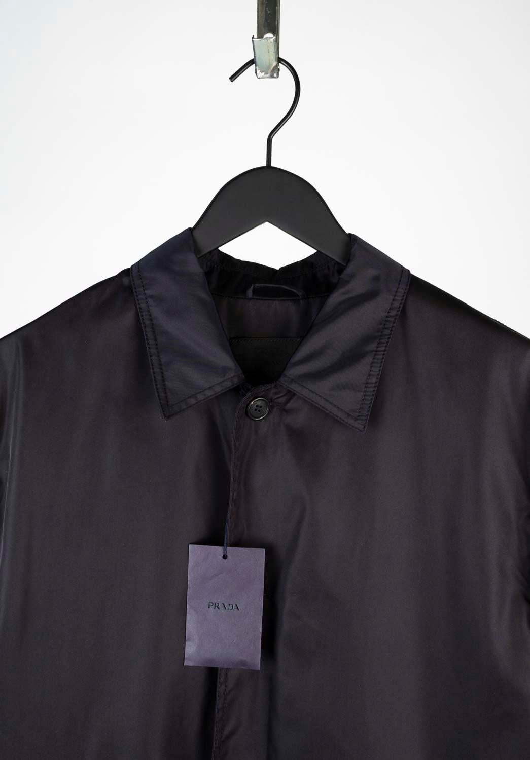 100% genuine New Prada Raincoat, S569
Color: Black
(An actual color may a bit vary due to individual computer screen interpretation)
Material: 100% nylon
Tag size: XL
This jacket is great quality item. Rate 10 of 10, new with tags.
Actual 