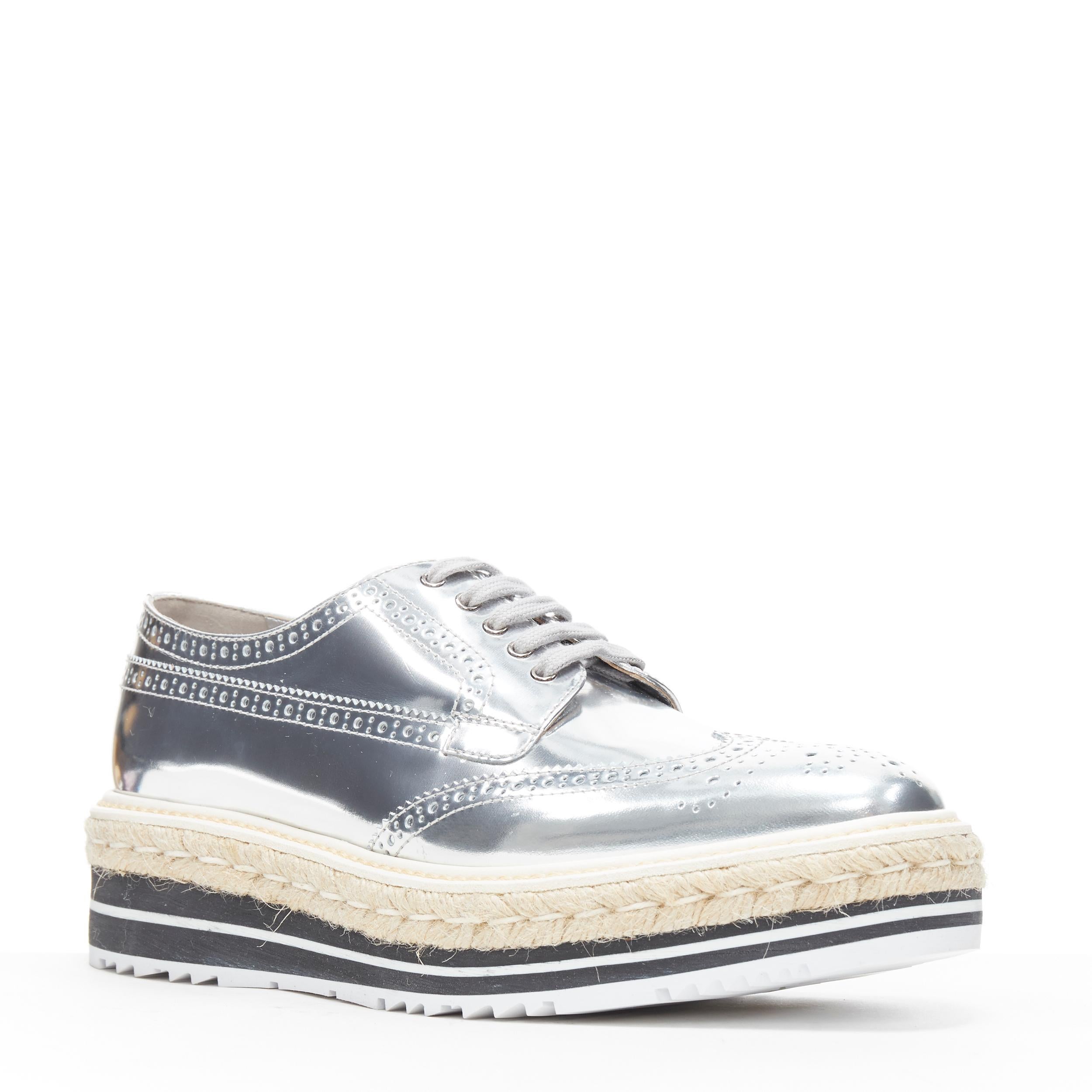 new Prada espadrille in pelle specchiata argento con piattaforma in iuta brogue EU40.5 US10.5
Marchio: Prada
Stilista: Miuccia Prada
Nome del modello / Stile: Piattaforma brogue
Materiale: Pelle
Colore: Argento
Modello: Tinta unita
Chiusura: