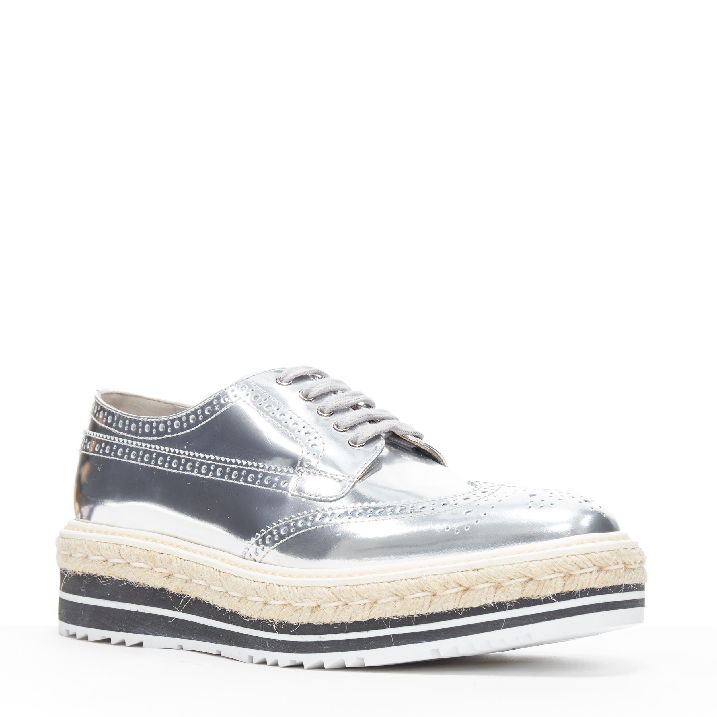 new PRADA mirrored silver leather espadrille jute platform brogue EU40.5 US10.5
Brand: Prada
Designer: Miuccia Prada
Model Name / Style: Platform brogue
Material: Leather
Color: Silver
Pattern: Solid
Closure: Lace up
Extra Detail: Mirrored silver