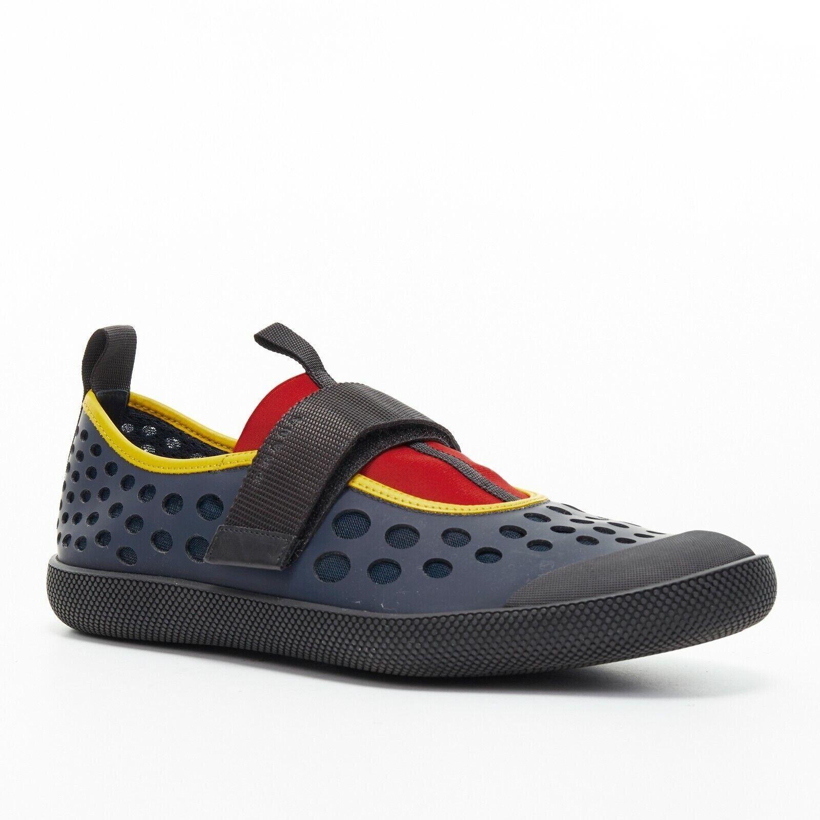 new PRADA navy holey cut out rubber magic tape strap low casual sneaker UK7.5
Reference: TGAS/A03038
Brand: Prada
Designer: Miuccia Prada
Model: Hole cutout sneaker
Material: Rubber
Color: Blue, Red
Pattern: Solid
Lining: Leather
Extra Details: Blue
