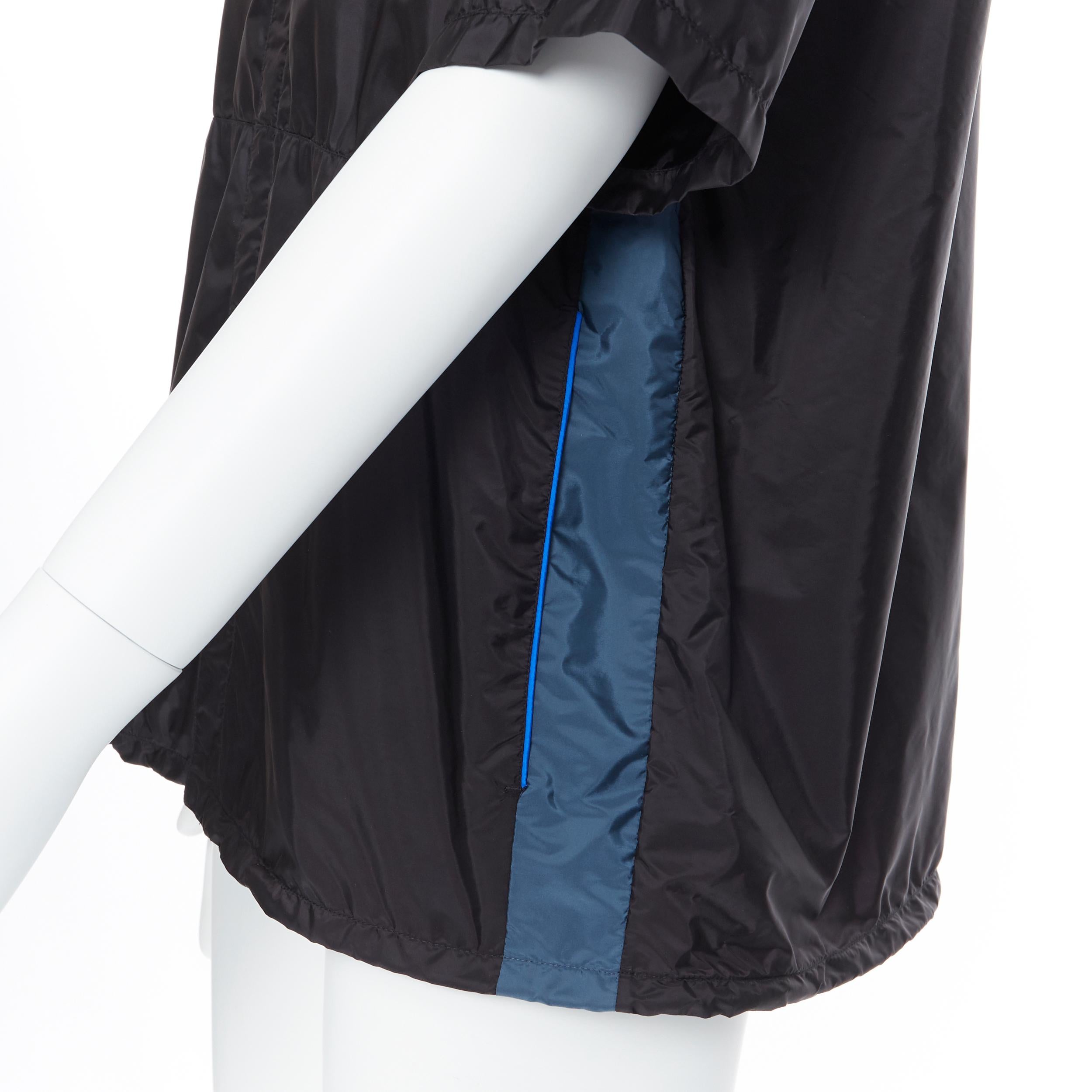 new PRADA Nylon 2018 black blue stripe piping short sleeve boxy shirt top L 
Reference: TGAS/A05734 
Brand: Prada 
Designer: Miuccia Prada 
Collection: 2018 
Material: Nylon 
Color: Black 
Pattern: Solid 
Closure: Zip 
Extra Detail: Zip front