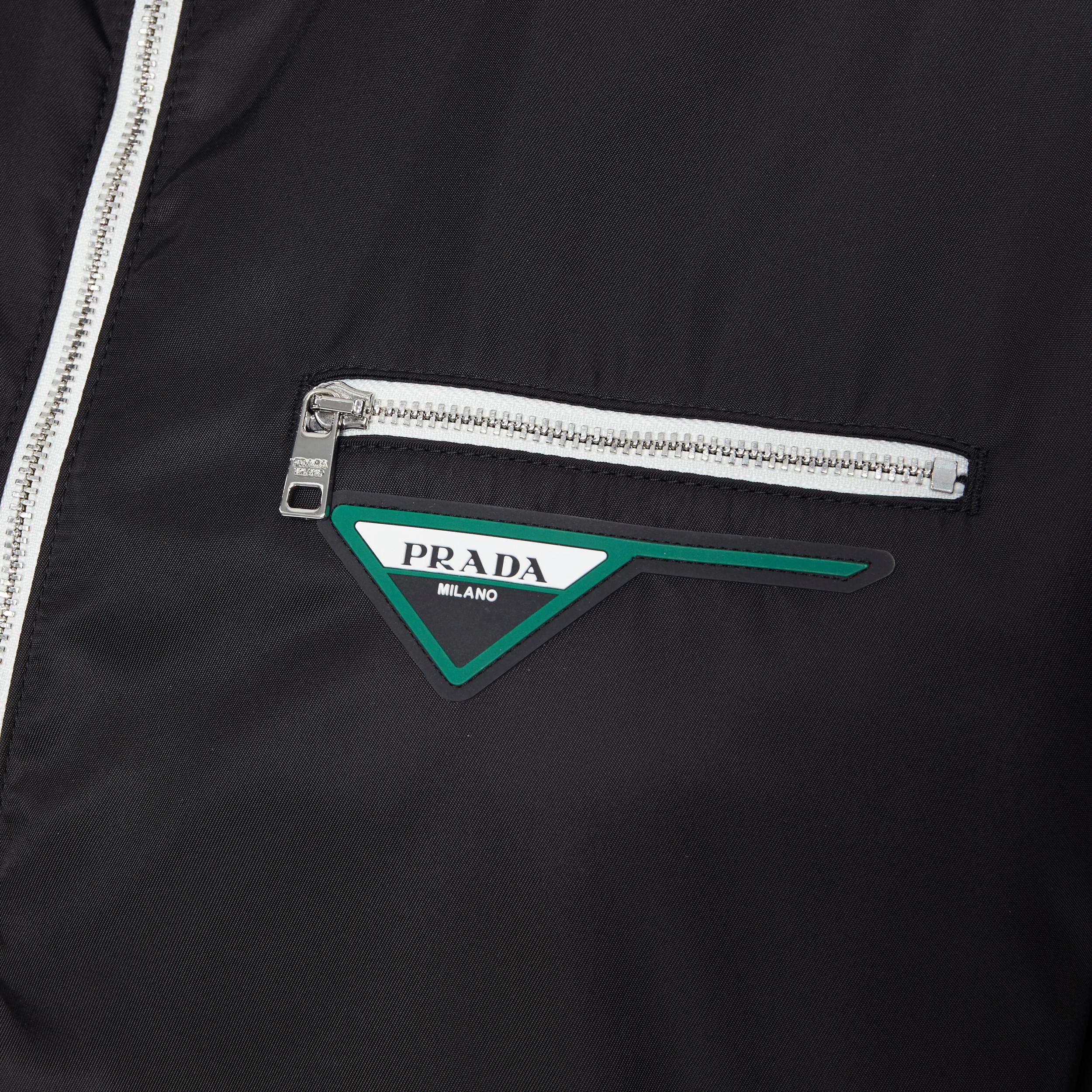new PRADA Nylon 2018 black triangle logo zip front MA-1 bomber jacket IT40 S 
Reference: TGAS/A05709 
Brand: Prada 
Designer: Miuccia 
Prada Collection: 2018 
Material: Nylon 
Color: Black 
Pattern: Solid 
Closure: Zip 
Extra Detail: Zip front