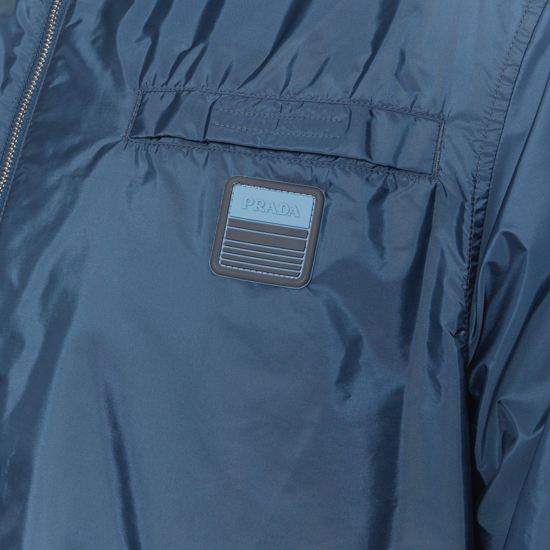 new PRADA Nylon 2018 blue sport rubber logo badge zip shirt shell jacket XL 
Reference: TGAS/A05716 
Brand: Prada 
Designer: Miuccia Prada 
Collection: 2018 
Material: Nylon 
Color: Blue 
Pattern: Solid 
Closure: Zip 
Extra Detail: Prada logo rubber