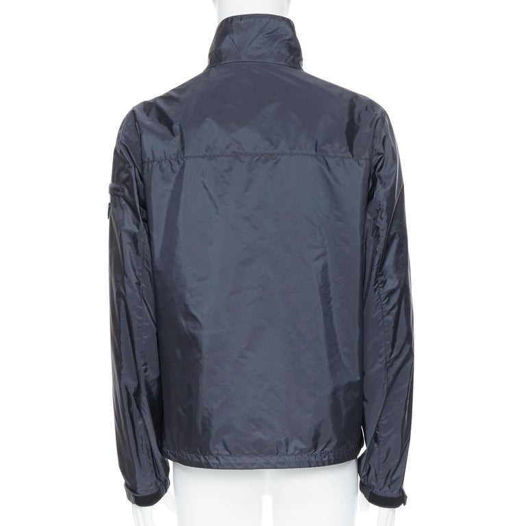 new PRADA Nylon 2018 grey enamel triangle rubber cuff zip shell jacket IT52  XL For Sale at 1stDibs