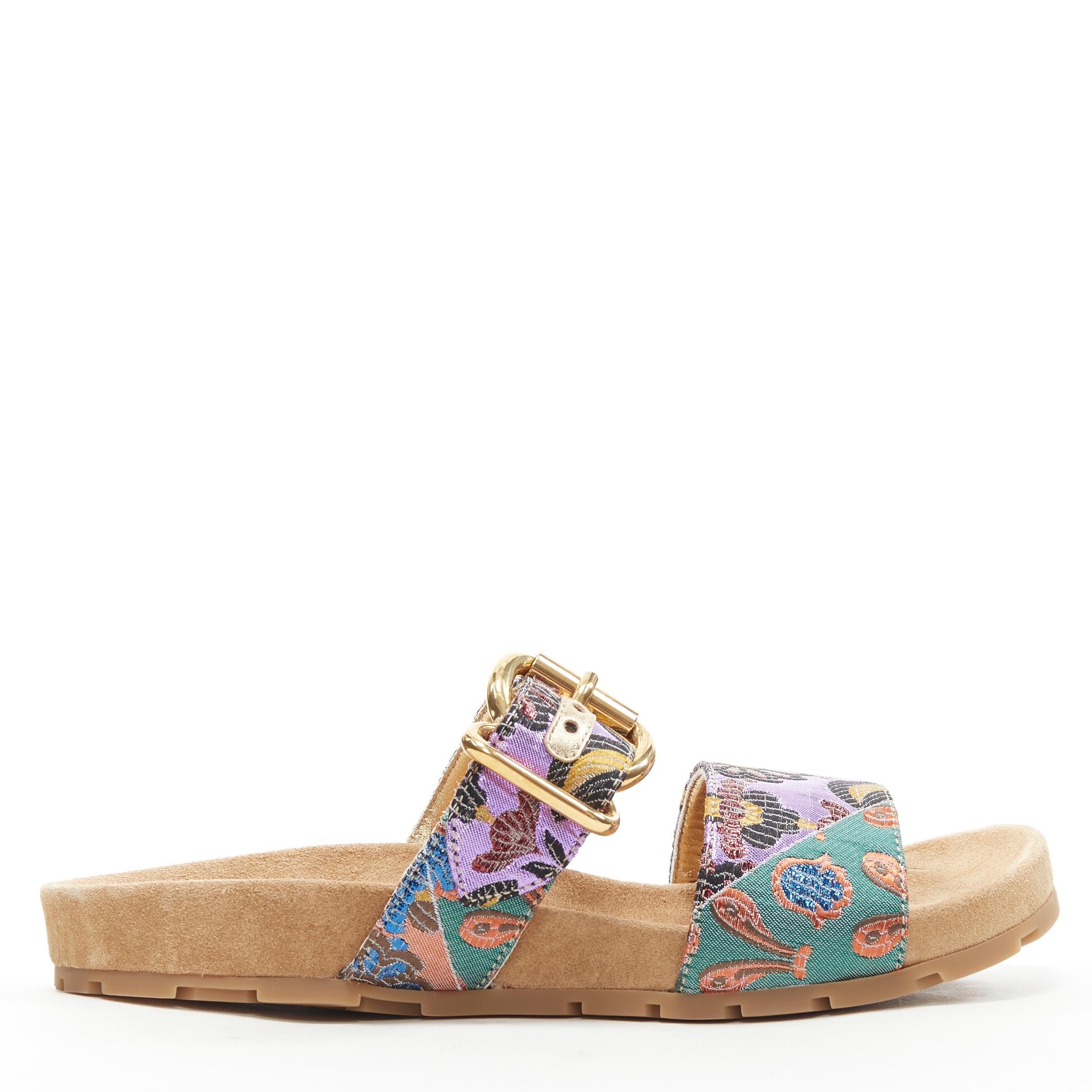 new PRADA patchwork floral jacquard gold buckle strap suede slides sandal EU36.5 
Reference: TGAS/B00619 
Brand: Prada 
Designer: Miuccia Prada 
Model: Bruciato Jacquard slides 
Collection: 2017 
Material: Fabric 
Color: Multicolour 
Pattern: Floral