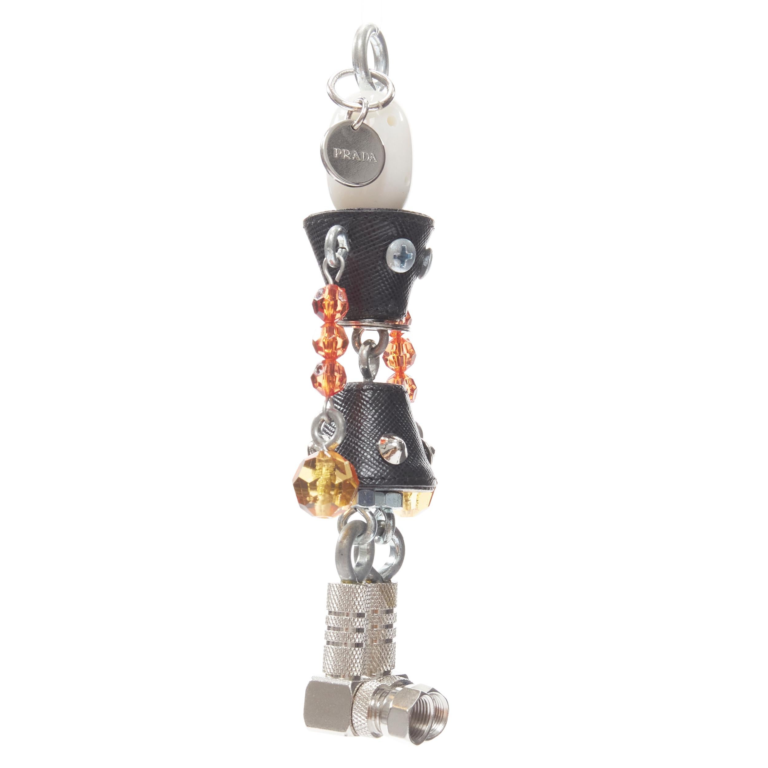 new PRADA pearl resin head beaded arms saffiano bolt hardware keychain bag charm 
Reference: TGAS/B01414 
Brand: Prada 
Material: Leather 
Color: Black 
Pattern: Solid 
Extra Detail: Pearlescent resin head. Black saffiano body. Silver hardware bolt.