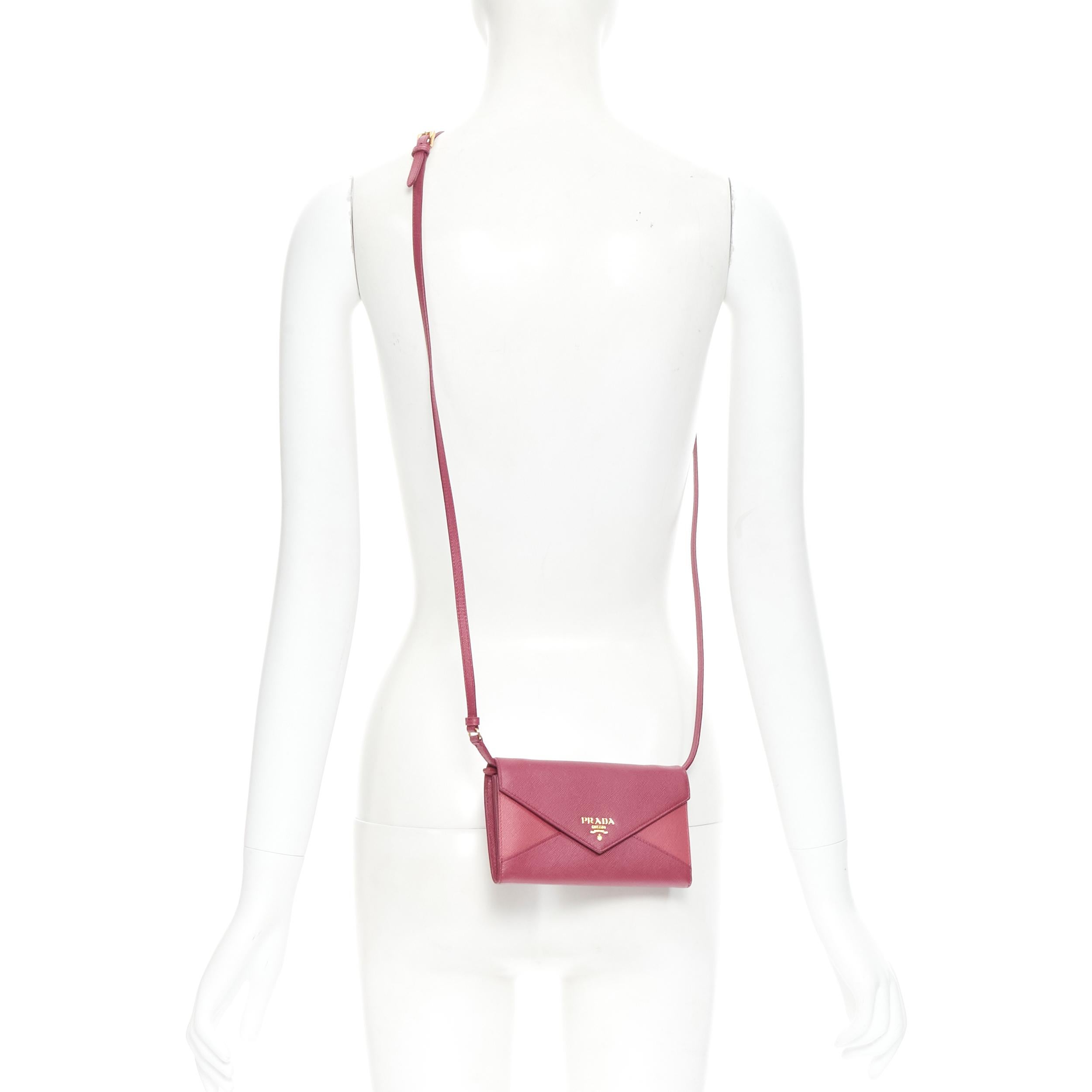 new PRADA pink diamond envelop gold logo wallet on chain crossbody clutch bag 
Reference: TGAS/B01442 
Brand: Prada 
Designer: Miuccia Prada 
Model: Envelop wallet on chain 
Material: Leather 
Color: Pink 
Pattern: Solid 
Closure: Button 
Extra