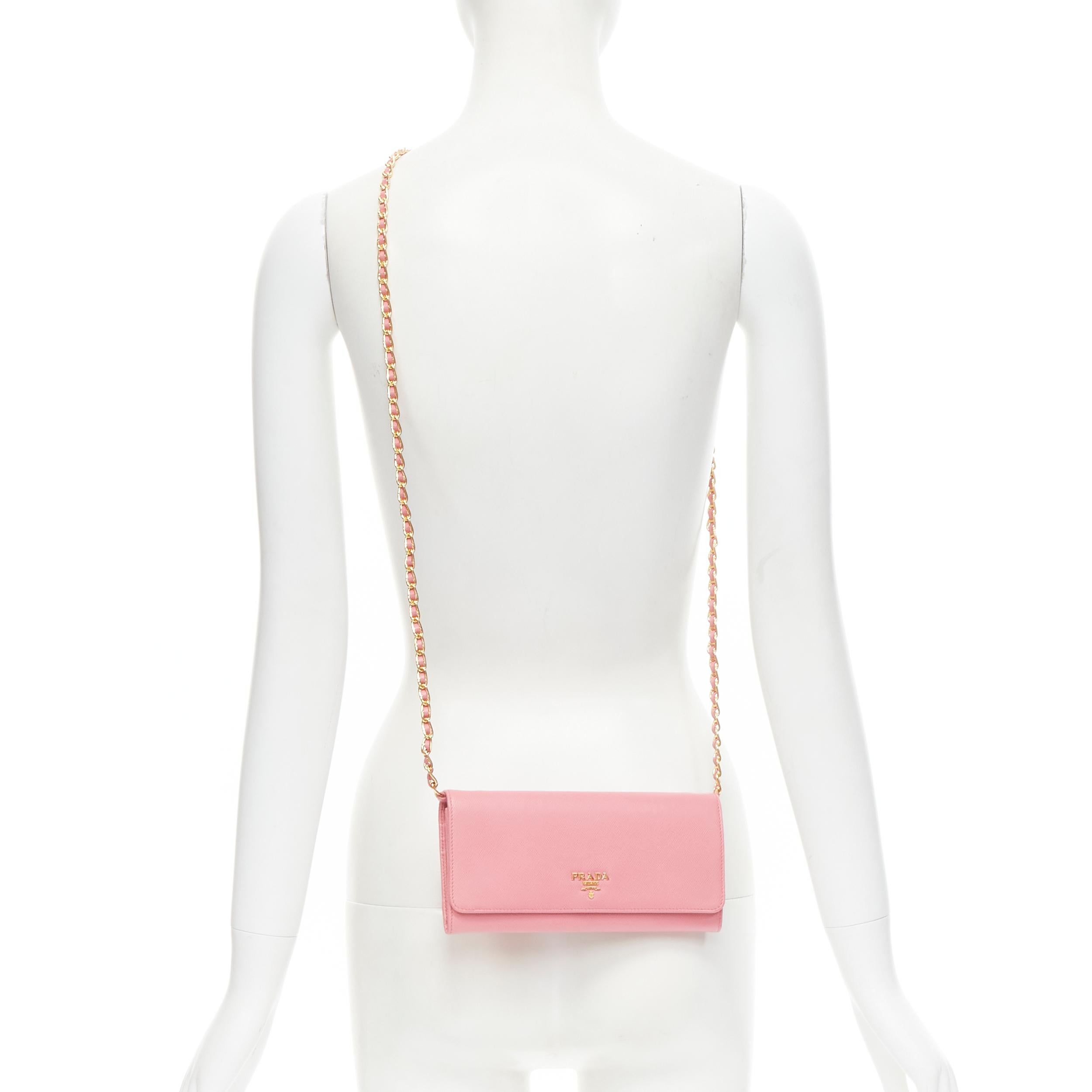 new PRADA pink saffiano gold logo flap wallet on chain clutch bag 
Reference: TGAS/B01440 
Brand: Prada 
Designer: Miuccia Prada 
Model: Saffiano wallet on chain 
Material: Leather 
Color: Pink 
Pattern: Solid 
Closure: Button 
Extra Detail: