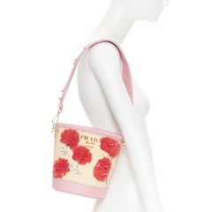 new PRADA raffia woven 3D floral bead embellished pink leather bucket bag