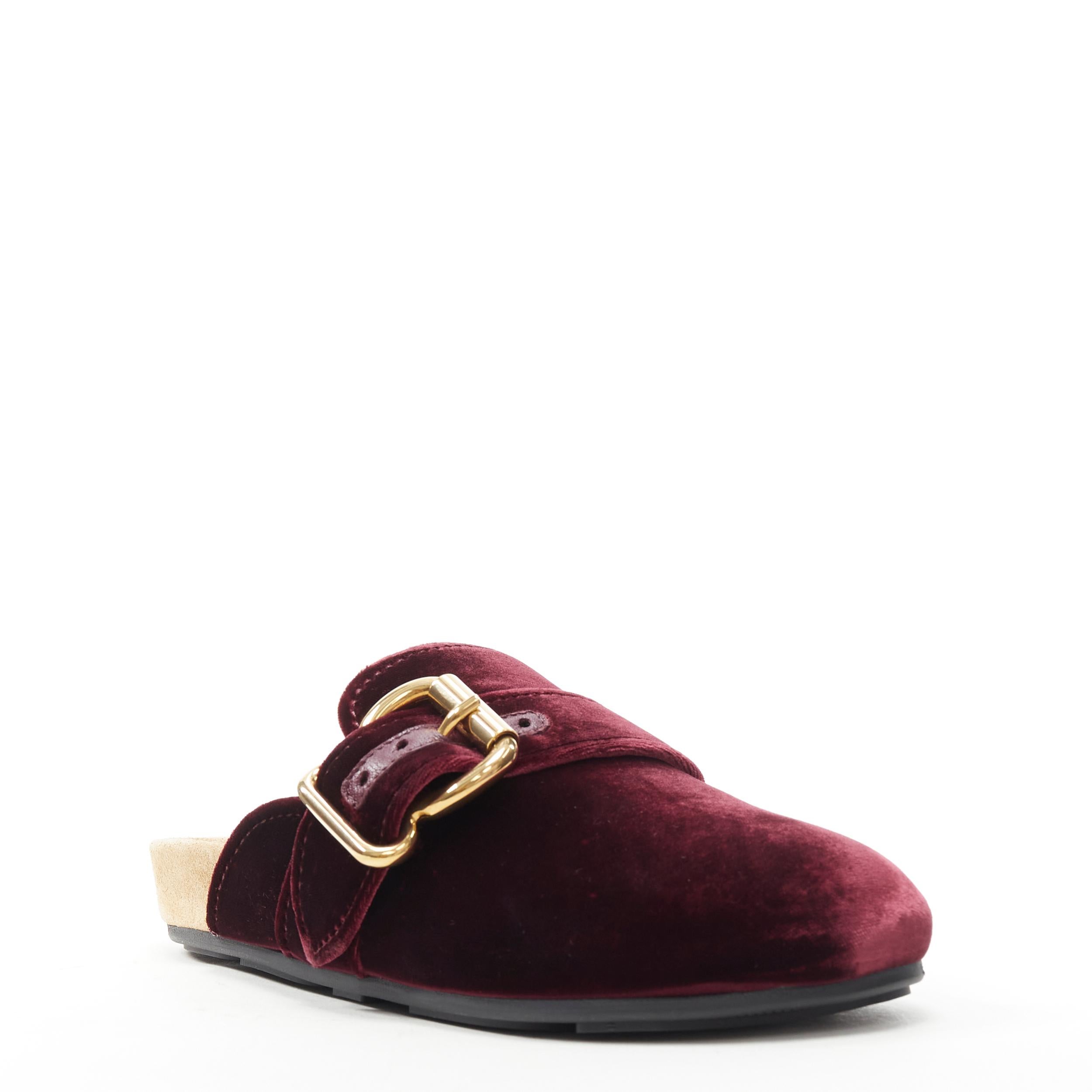 new PRADA rare burgundy red velvet gold buckle round toe slip on mule clog EU36 Reference: TGAS/B01147 
Brand: Prada 
Designer: Miuccia Prada 
Model: Velvet mule 
Material: Velvet 
Color: Burgundy 
Pattern: Solid 
Extra Detail: Smooth velvet upper.