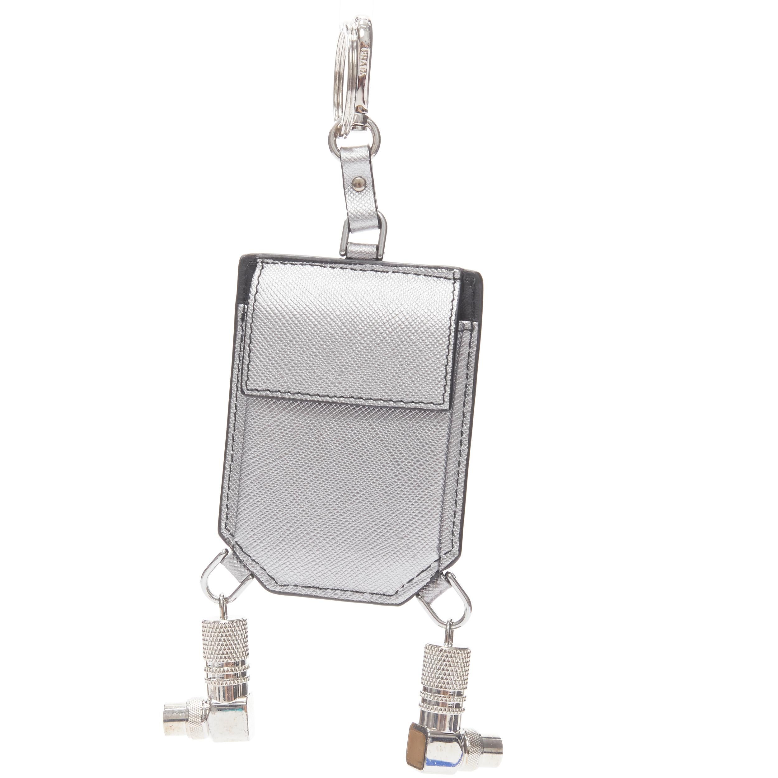new PRADA Robot blue silver saffiano leather logo bolt pocket keyring bag charm 
Reference: TGAS/B00998 
Brand: Prada 
Designer: Miuccia Prada 
Material: Leather 
Color: Silver 
Pattern: Solid 
Closure: Clasp 
Extra Detail: Silver and blue saffiano
