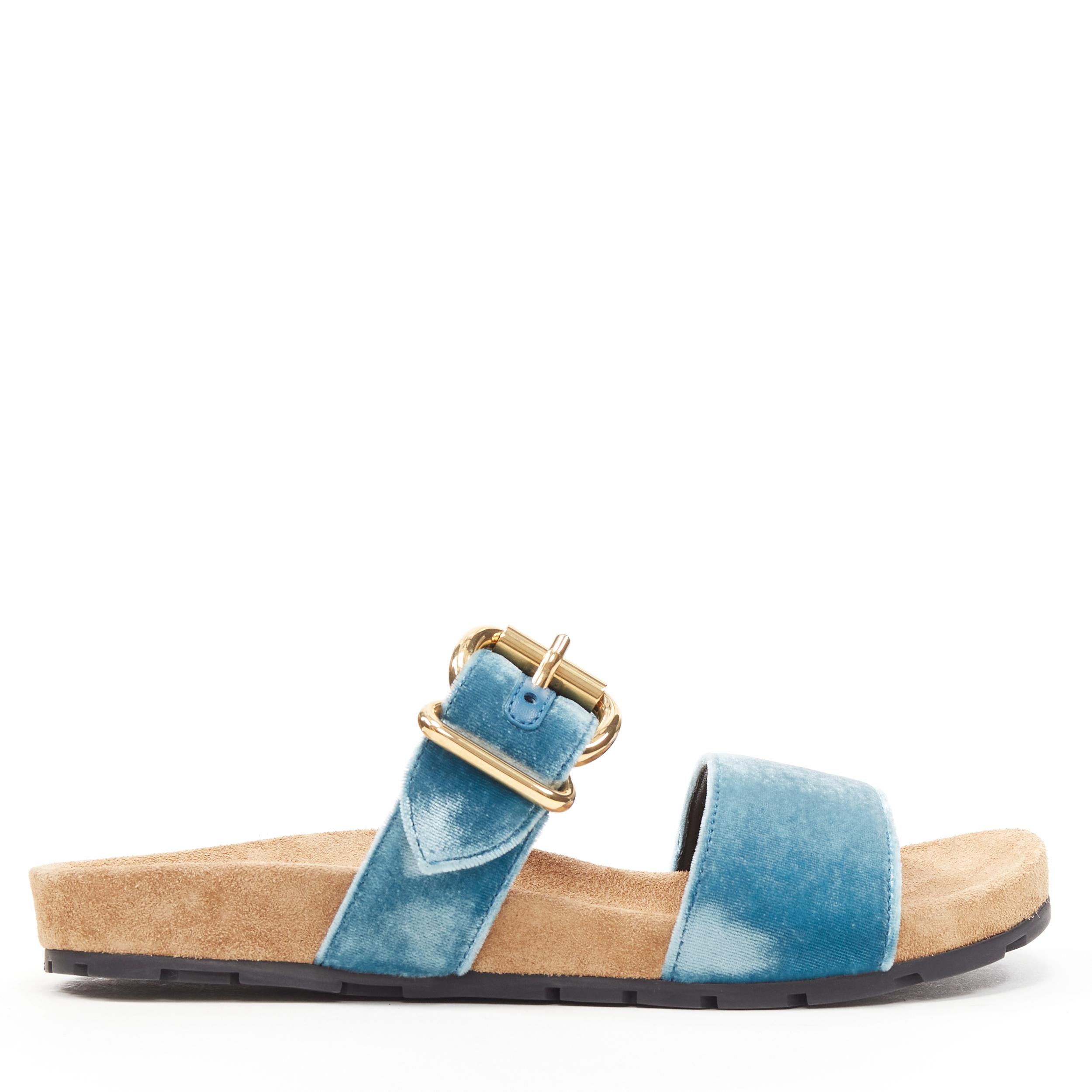 new PRADA sky blue velvet strap gold buckle slides flat sandals EU37 
Reference: TGAS/B00336 
Brand: Prada 
Designer: Miuccia Prada 
Model: Velvet slides 
Material: Velvet 
Color: Blue 
Pattern: Solid 
Closure: Buckle Extra Detail: Sky blue velvet