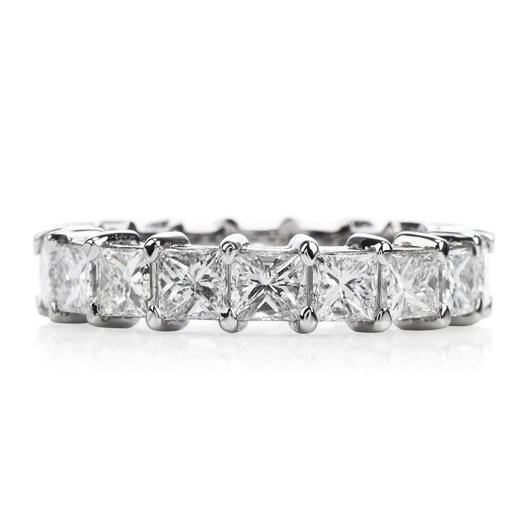 This princess cut diamond eternity Platinum band ring of outstanding sparkling aesthetic and timeless elegance is adorned with 17 high quality square cut diamonds, cumulatively weighing 4.70 carats, graded G-H color and VS1 clarity. The precious