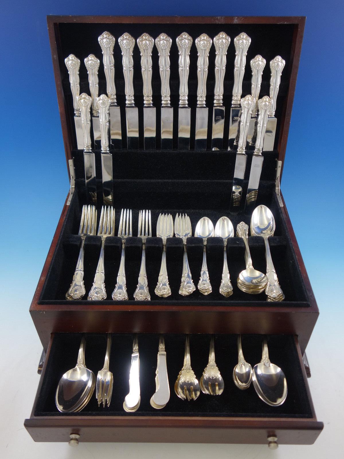 Large new queens by Durgin sterling silver dinner flatware set of 100 pieces. This shell motif pattern was introduced in the year 1900. This set includes:

8 dinner size knives, 9 3/4