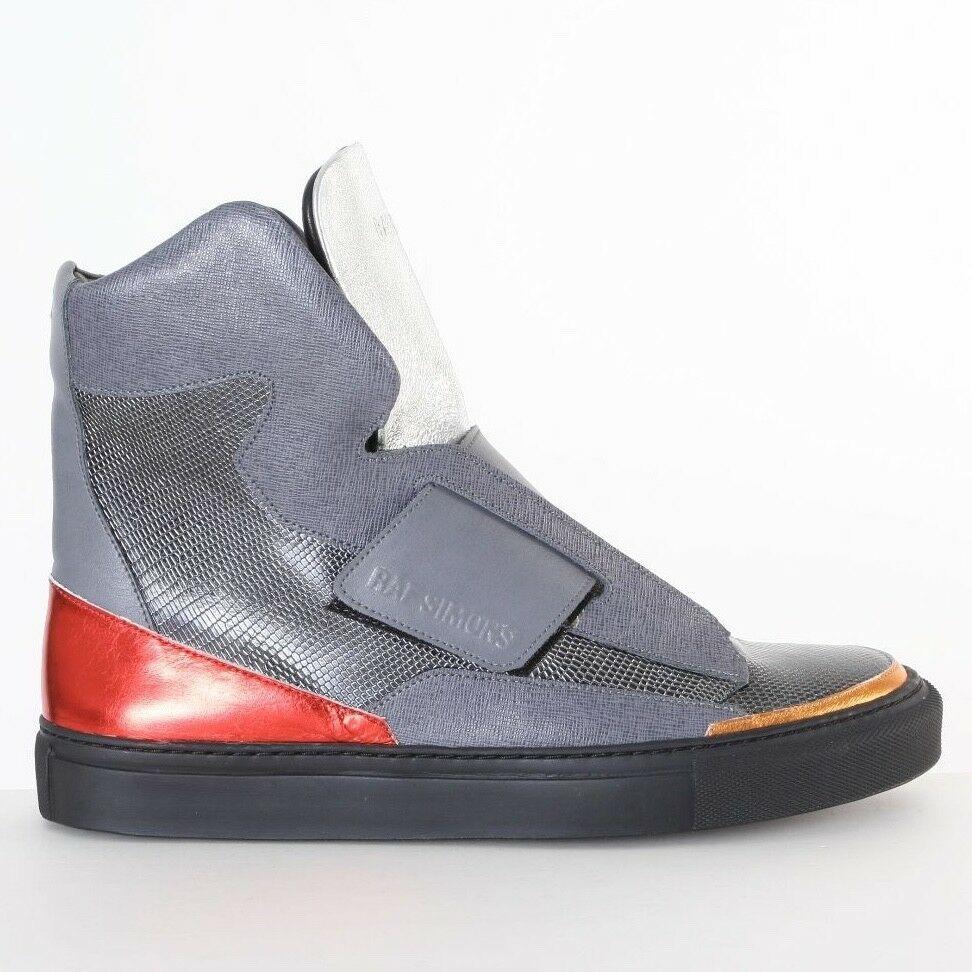 new RAF SIMONS STERLING RUBY silver strapped high top sneakers shoes EU40 US7
RAF SIMONS / STERLING RUBY
FROM THE HIGHLY COVETED FALL WINTER 2014 COLLECTION
HIGH TOP SNEAKERS. BOLD MULTI-TEXTURED UPPER. 
METALLIC, CROSSHATCH AND LIZARD EFFECT