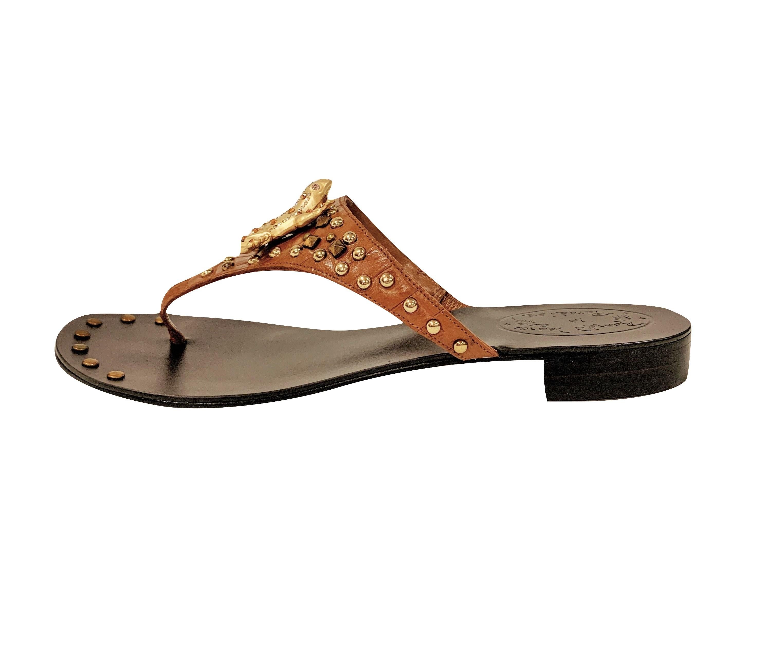 Ramon Tenza Spain
Brand New
Cognac & Gold Thong Sandals
* Gold Frog Adornment
* Cognac Leather
* Gold Beading
* Size: 8
* 1.25