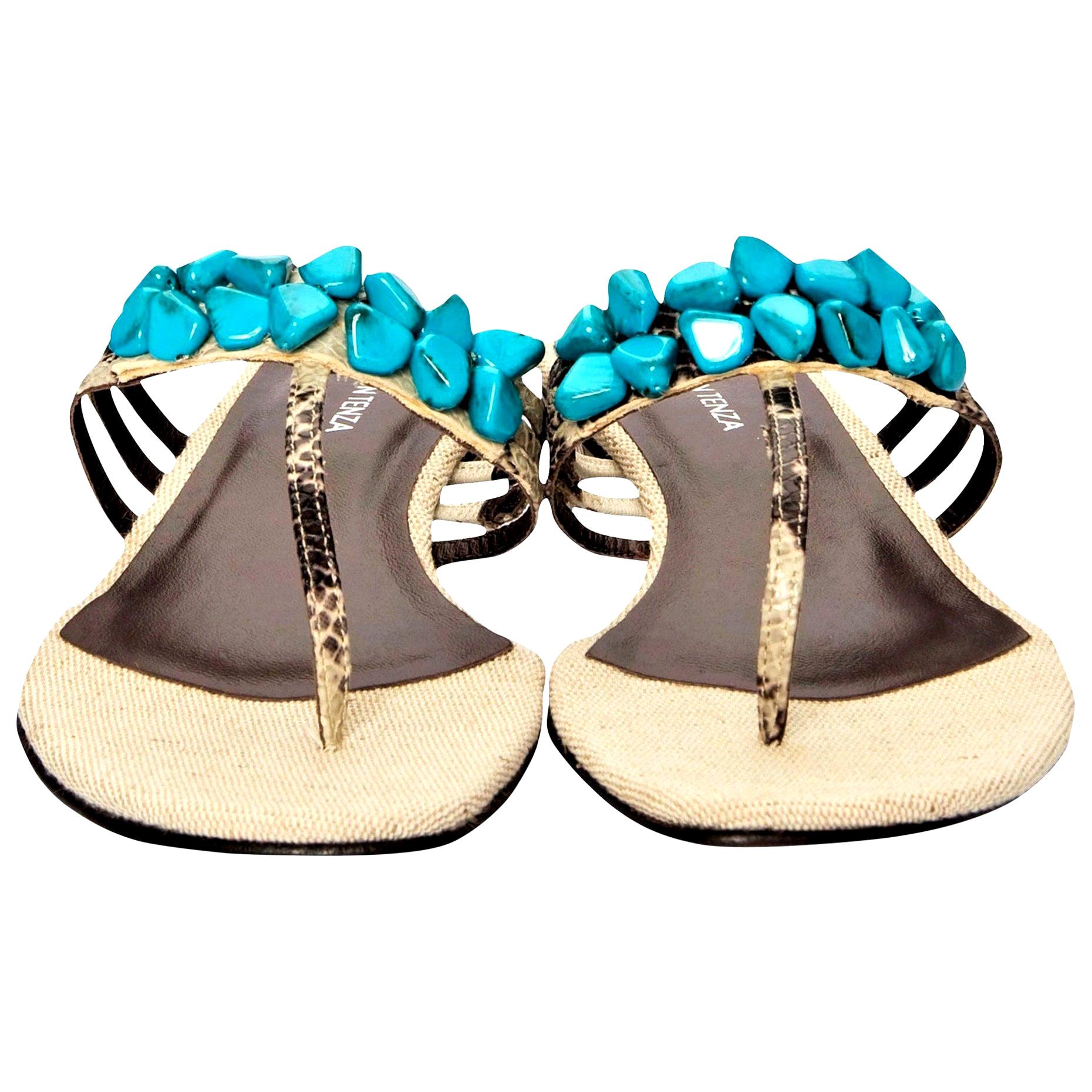 Ramon Tenza Spain
Brand New
Beige & Turquoise Thong Sandals
* Padded Leather Footbed
* Snakeskin Heel & Strap
* Faux Turquoise Beading
* Size: 10
* 1.25