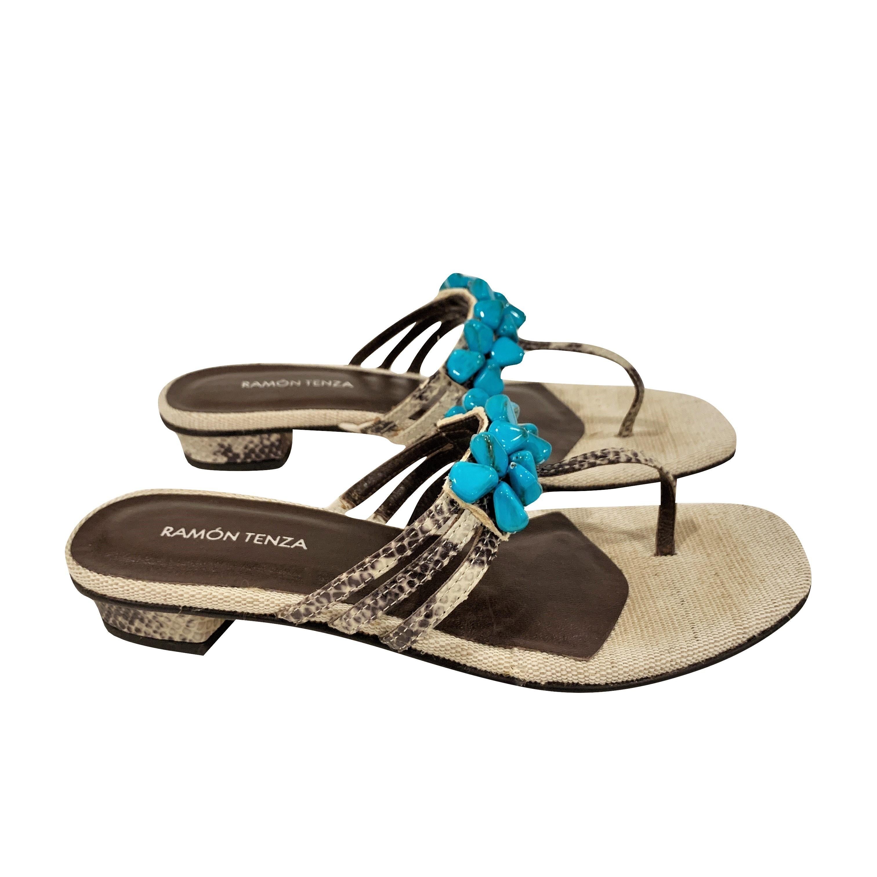 Ramon Tenza Spain
Brand New
Beige & Turquoise Thong Sandals
* Padded Leather Footbed
* Snakeskin Heel & Strap
* Faux Turquoise Beading
* Size: 6
* 1.25