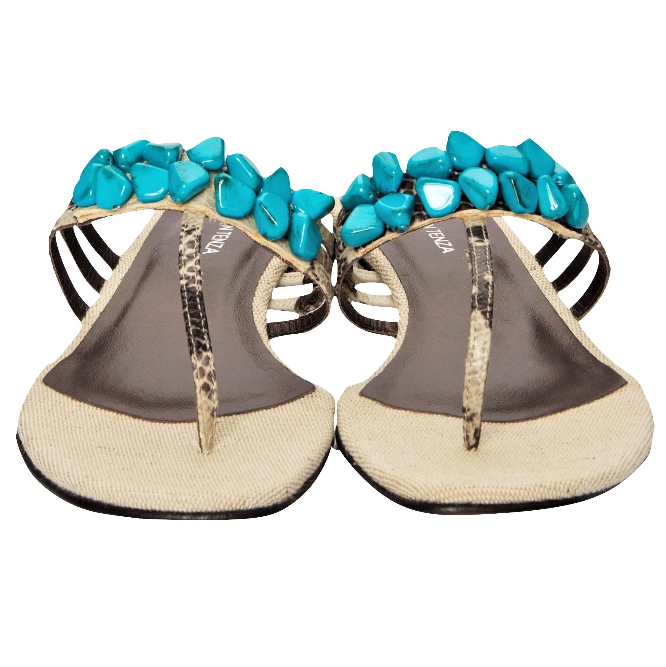 Ramon Tenza Spain
Brand New
Beige & Turquoise Thong Sandals
* Padded Leather Footbed
* Snakeskin Heel & Strap
* Faux Turquoise Beading
* Size: 8.5
* 1.25