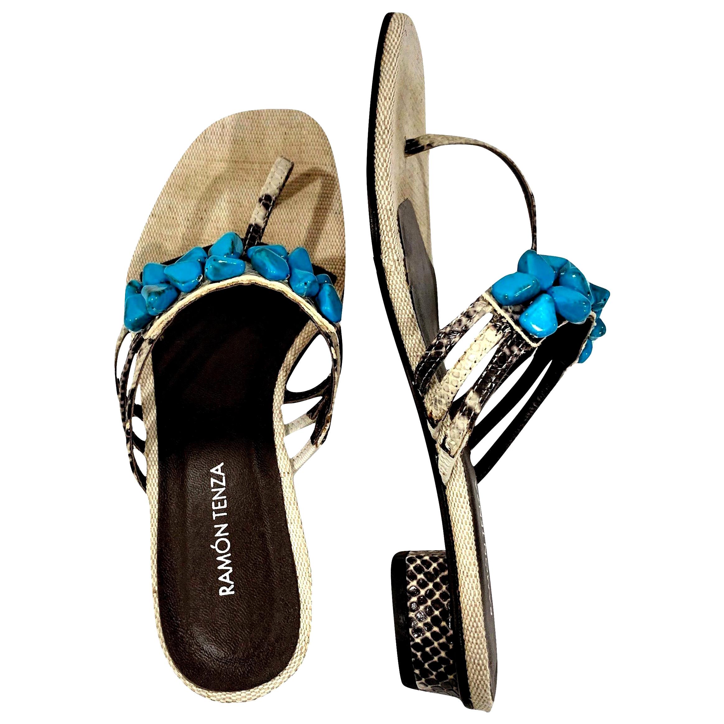 Ramon Tenza Spain
Brand New
Beige & Turquoise Thong Sandals
* Padded Leather Footbed
* Snakeskin Heel & Strap
* Faux Turquoise Beading
* Size: 9.5
* 1.25