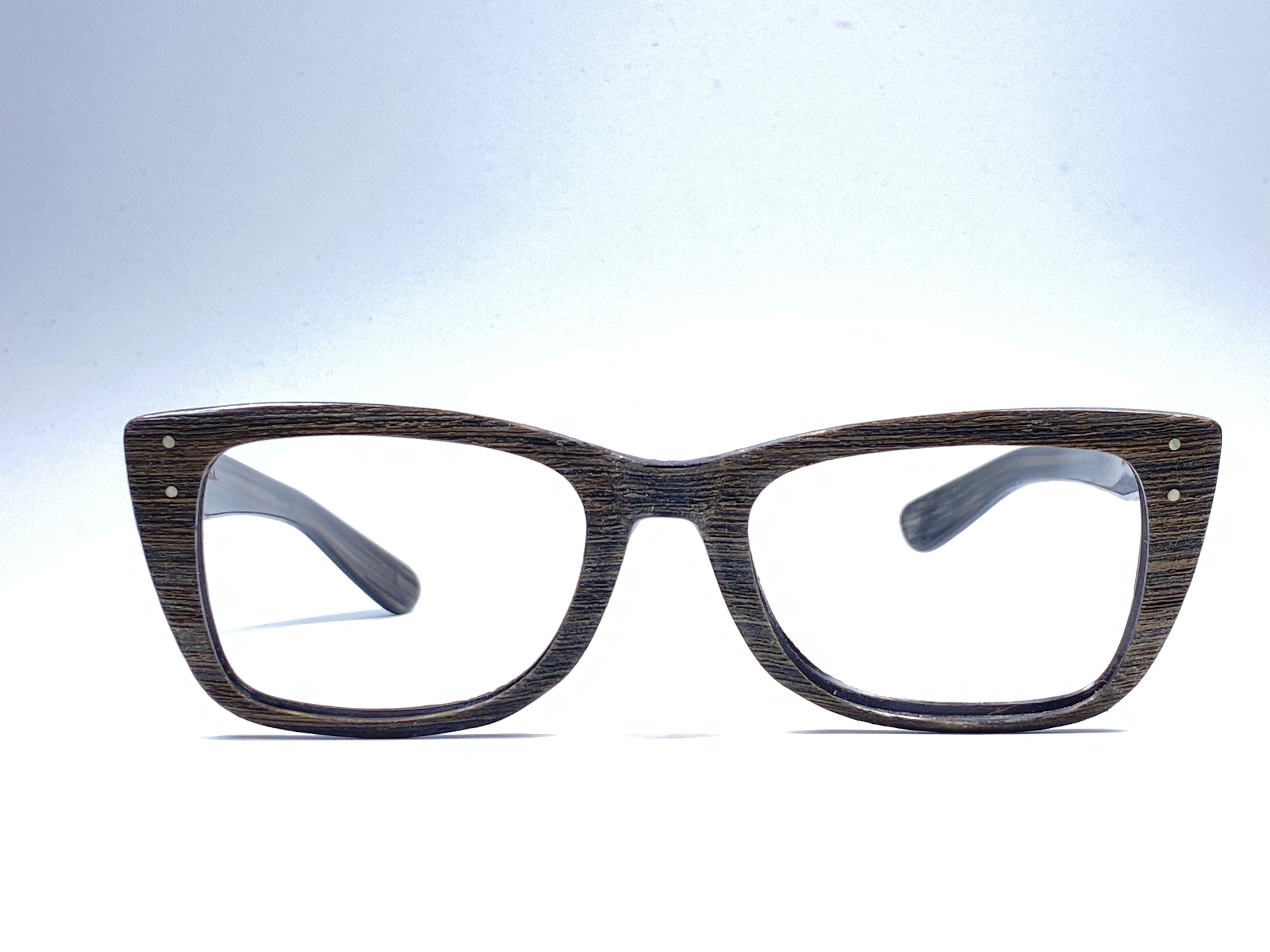 Super Rare 1960's Caribbean in dark wood with thinner and elongated temples .  
Bausch and Lomb USA Made. No lenses. Ready for your prescription lenses.
 Straight out of the 1960's. All hallmarks. Minor sign of wear due to 60 years of storage. A