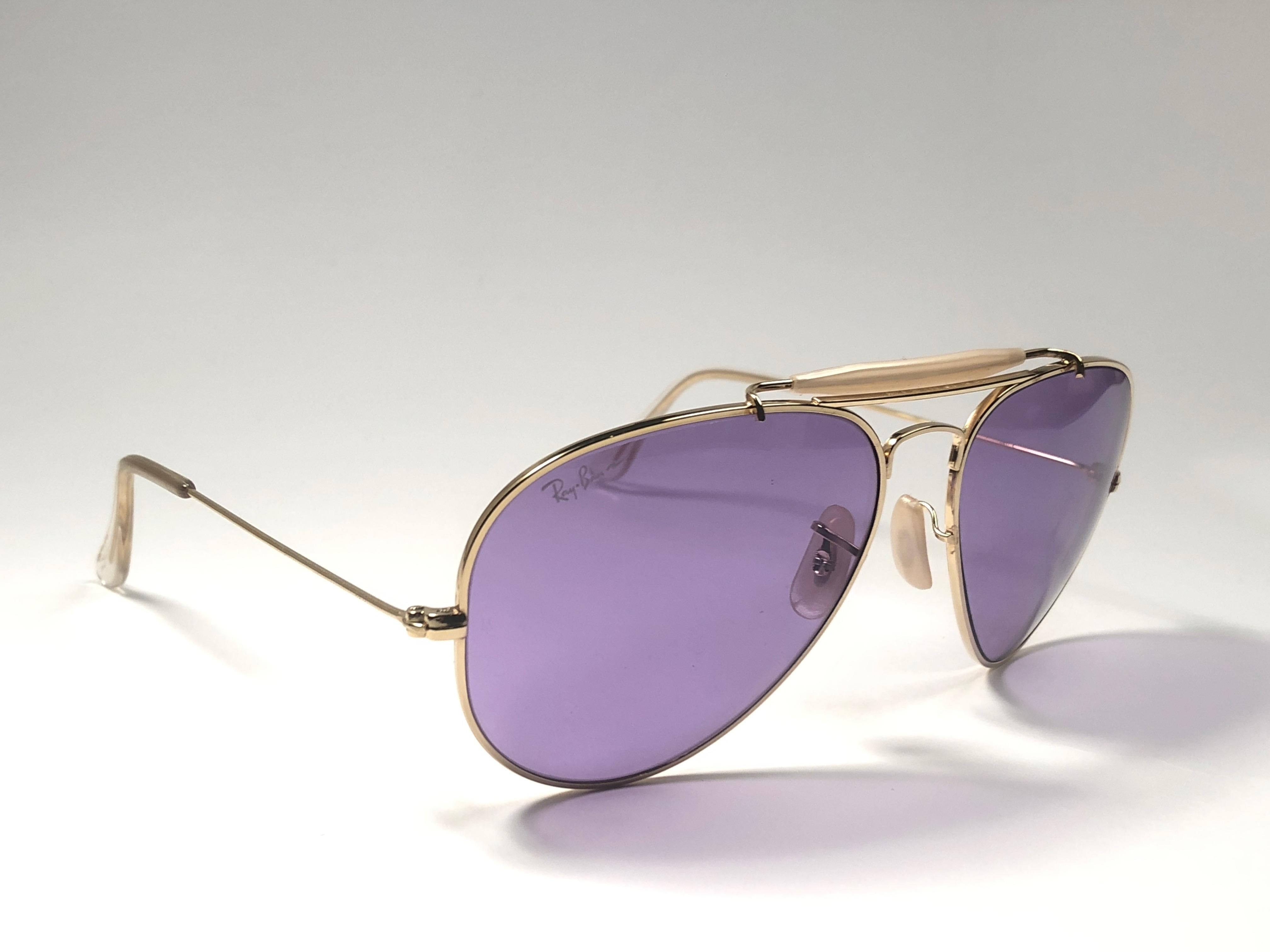 New, rare and sought after Vintage Ray Ban Purple Chromax. 
62Mm outdoorsman gold frame holding a pair of purple Chromax B&L etched lenses.

New, never worn or displayed, this item is a superb find.
This item have minor sign of wear due to storage