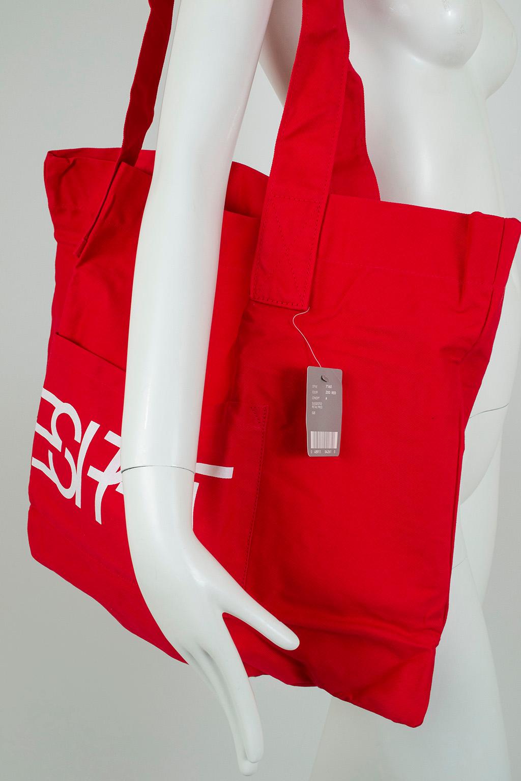 Carry your essentials in retro style with this flashback to the punchy 1980s. Brand new in original package, featuring the house’s famous block lettering and signature color. 

Open canvas tote with double shoulder handles; exterior pocket with