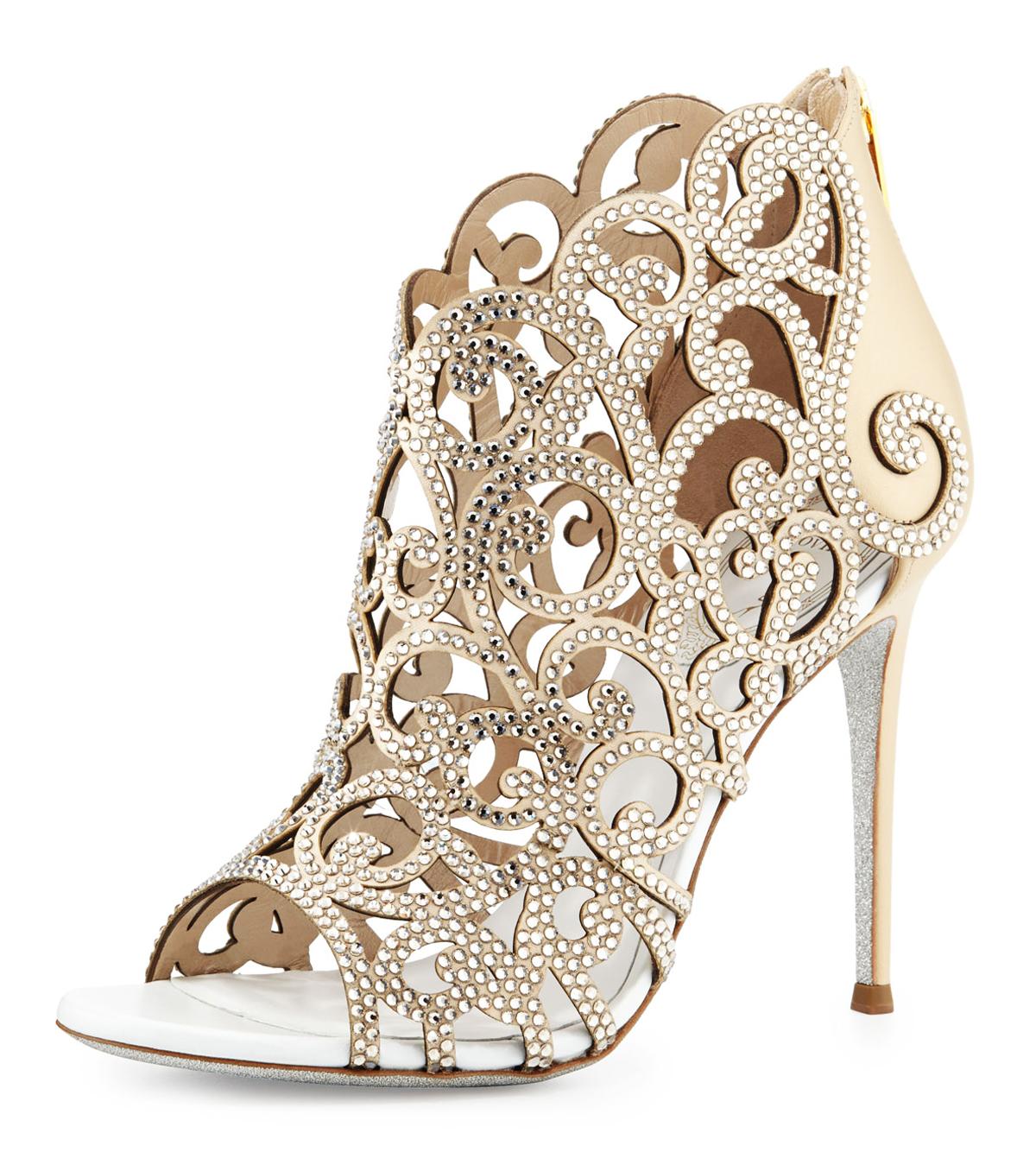New Rene Caovilla Swarovski Crystal-Embellished Leather Ankle Sandals.
Designer size 37.5
Scroll Laser-Cut Vamp, Open Toe. Back Zip Eases Dress. White Leather Lining.
Signature Glittered Sole. Covered Heel - 4 inches.
Made in Italy. 
Retail