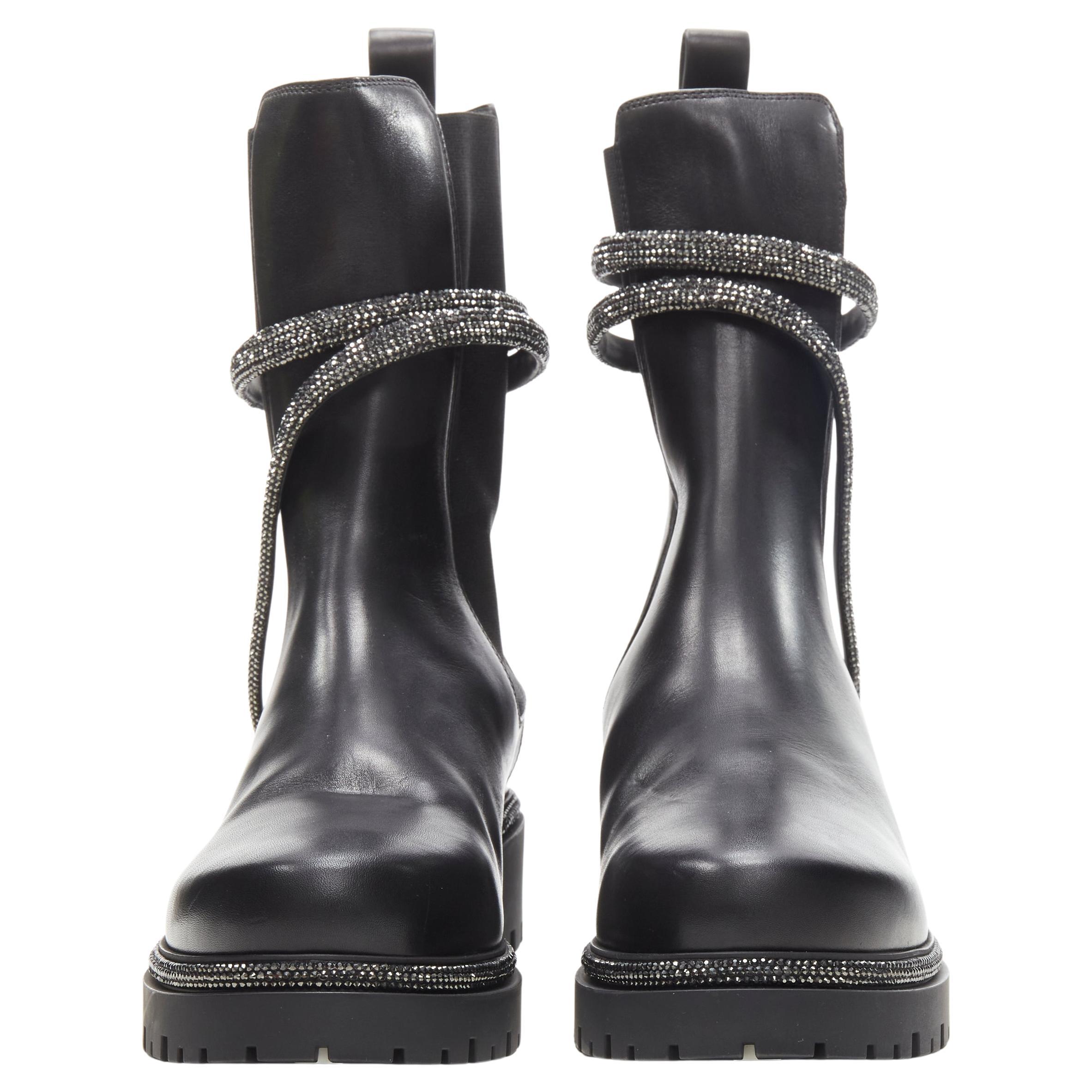 new RENE CAOVILLA Cleo black leather silver crystal serpent combat boot EU39
Brand: Rene Caovilla
Extra Detail: Stretch gusset. Cleo serpentine inspired spiral wrap detailing. Trucker lug sole.

CONDITION:
Condition: New without tags.