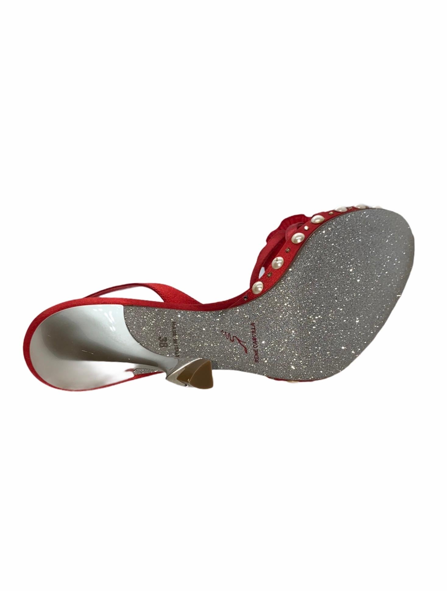     A RENE CAOVILLA classic signature piece that will last you for years
    Pure luxury - handcrafted in their Italian workshop
Beautiful flower detail
Faux pearl details
Beautifully carved heel
    Made in Italy
Size 38 EU
    Complete in RENE