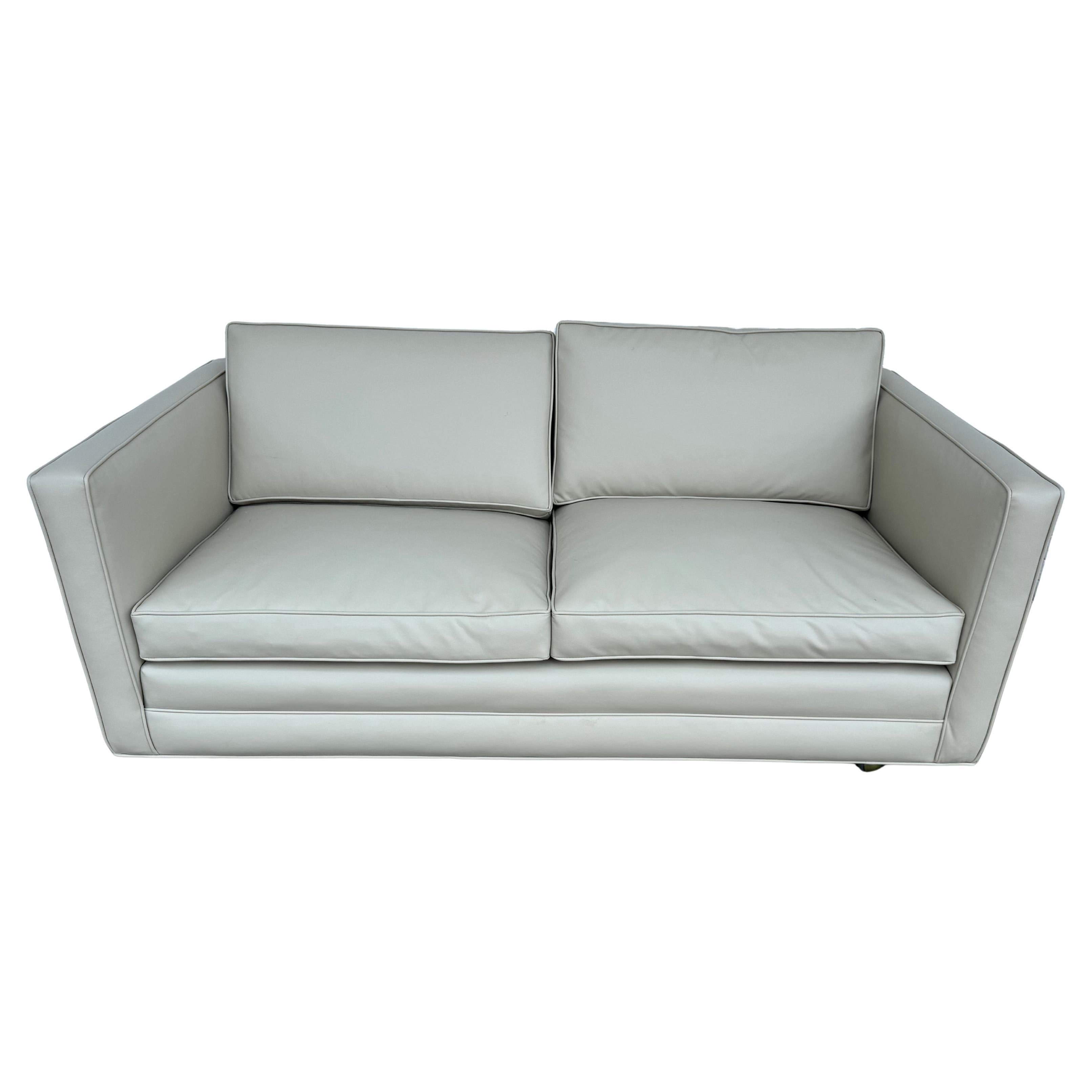 This is an even arm Tuxedo loveseat by Dunbar Furniture.
It has 3 cushioned seats and is on casters for easy movability.
It has be newly reupholstered in a rich off white Ultra Fabric.
 
We also have a matching sofa and lounge chairs. 