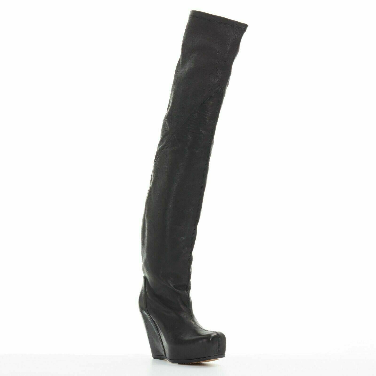 new RICK OWENS black leather square toe platform wedge knee high OTK boots EU36

RICK OWENS
New with box and dustbag. 
Black laether. 
Mixed leather. 
Stretch supple leather at opening. 
Stiffer leather shaft. 
Square toe design. 
Concealed platform