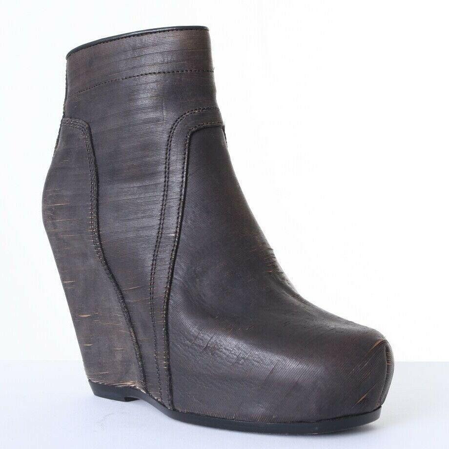 new RICK OWENS brown slashed leather classic wedge zip ankle boots EU36 US6 UK3
RICK OWENS
EXTREMELY RARE AND UNIQUE RENDITION OF LEATHER UPPER OF THE CLASSIC RICK OWENS BOOTS
PRISTINE NEW WITH BOX. 
BROWN LEATHER. 
MICRO SLASH LEATHER. 
INTENTIONAL