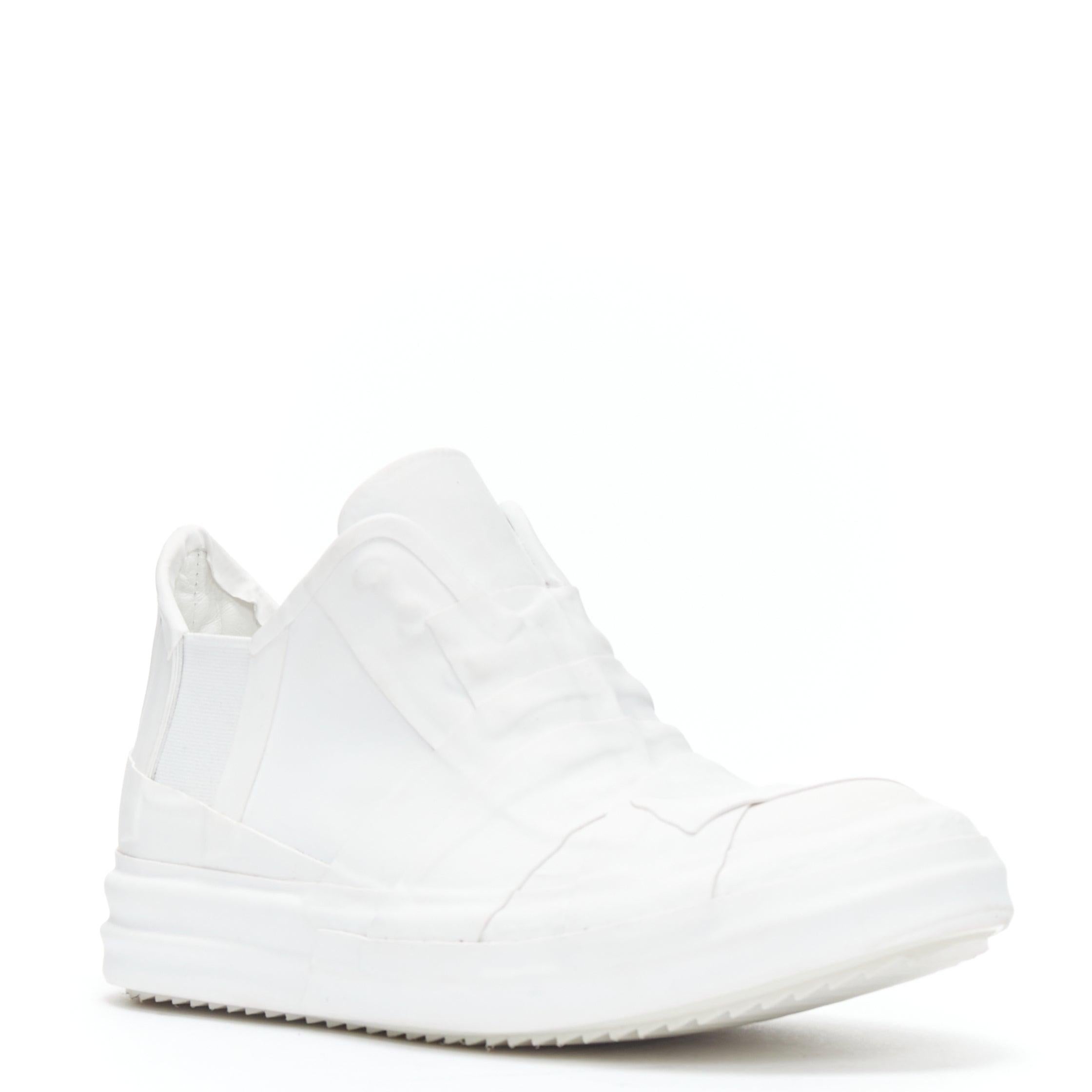 new RICK OWENS Geobasket Mummy Plaster wrapped white mid top sneaker EU36
Reference: TGAS/B01336
Brand: Rick Owens
Designer: Rick Owens
Model: White Plastered Geobasket
Material: Rubber
Color: White
Pattern: Solid
Closure: Stretchy
Extra Details: