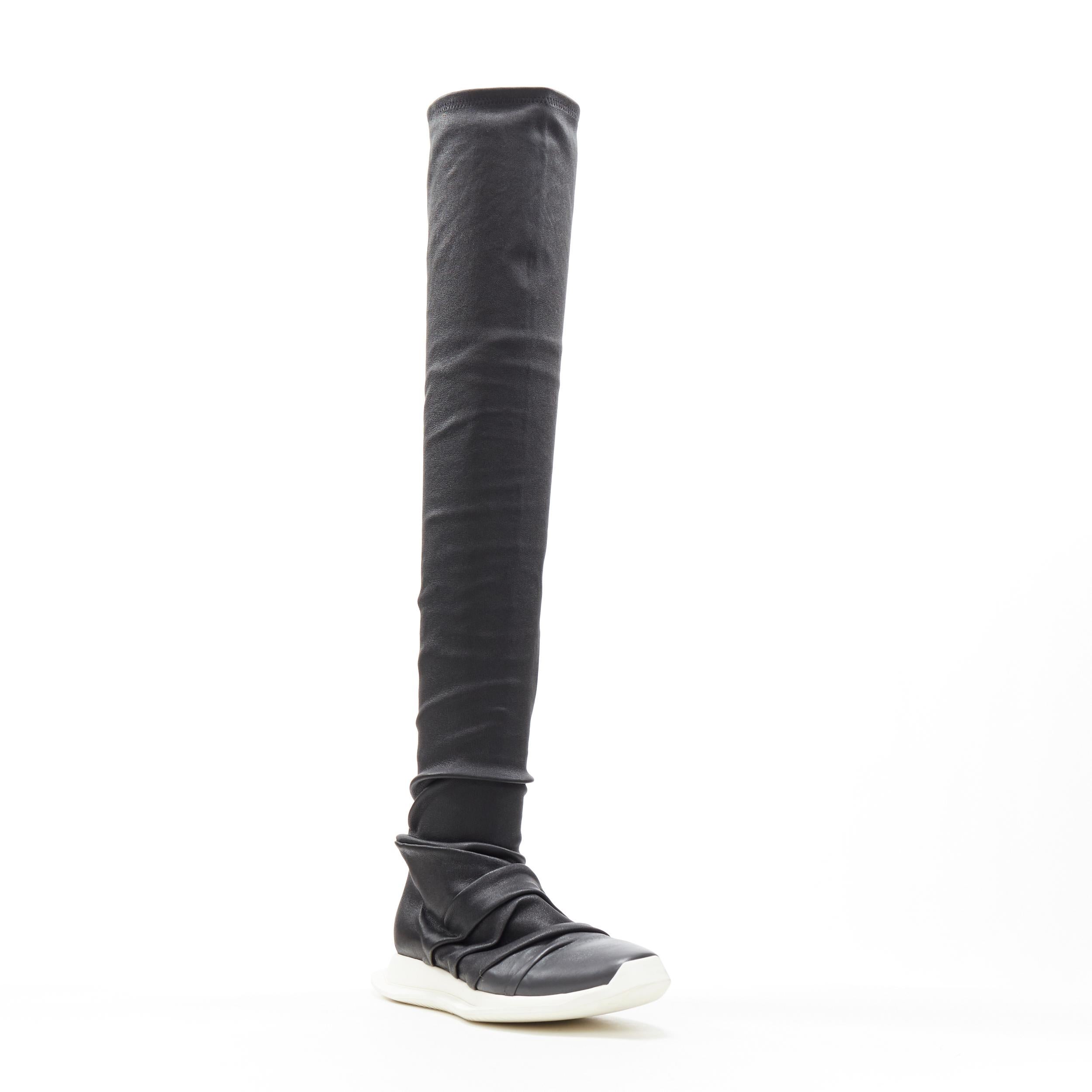 new RICK OWENS Runway Draped Oblique stretch leather knee high sneaker EU35.5 Reference: TGAS/B01177 
Brand: Rick Owens 
Designer: Rick Owens 
Model: Draped Oblique stocker sneaker 
Material: Leather 
Color: Black 
Pattern: Solid 
Closure: Stretch