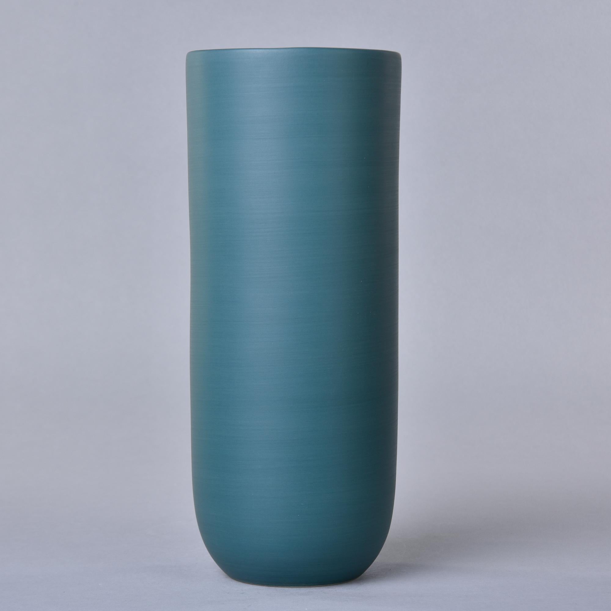 New and made in Italy by Rina Menardi, this tall Canna 1 vase stands over 12” tall. The vessel has a saturated teal green glaze and a matte black interior glaze. Signed on underside of base by the maker. 

We have an extensive inventory of new