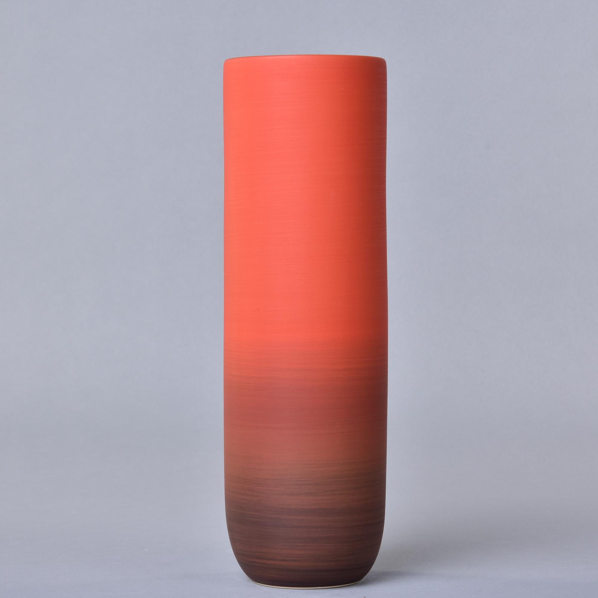 New and made in Italy by Rina Menardi, this tall Canna 2 vase has a poppy glaze. The deep orange red with has an ombre fade from bottom to top and a matte black interior glaze. Signed on underside of base by the maker. 

We have an extensive