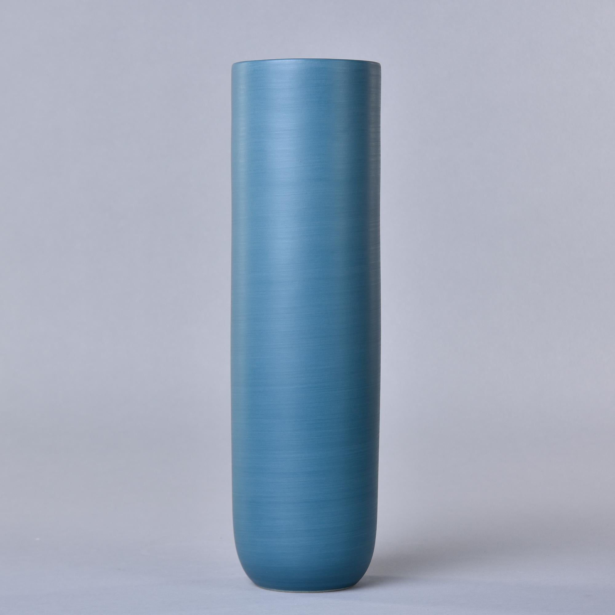 New and made in Italy by Rina Menardi, this ceramic vase is 14” tall. Exterior is glazed in teal blue - a matte finish saturated teal blue with a matte black interior. Signed by maker on underside of base. At the time of this posting, we have